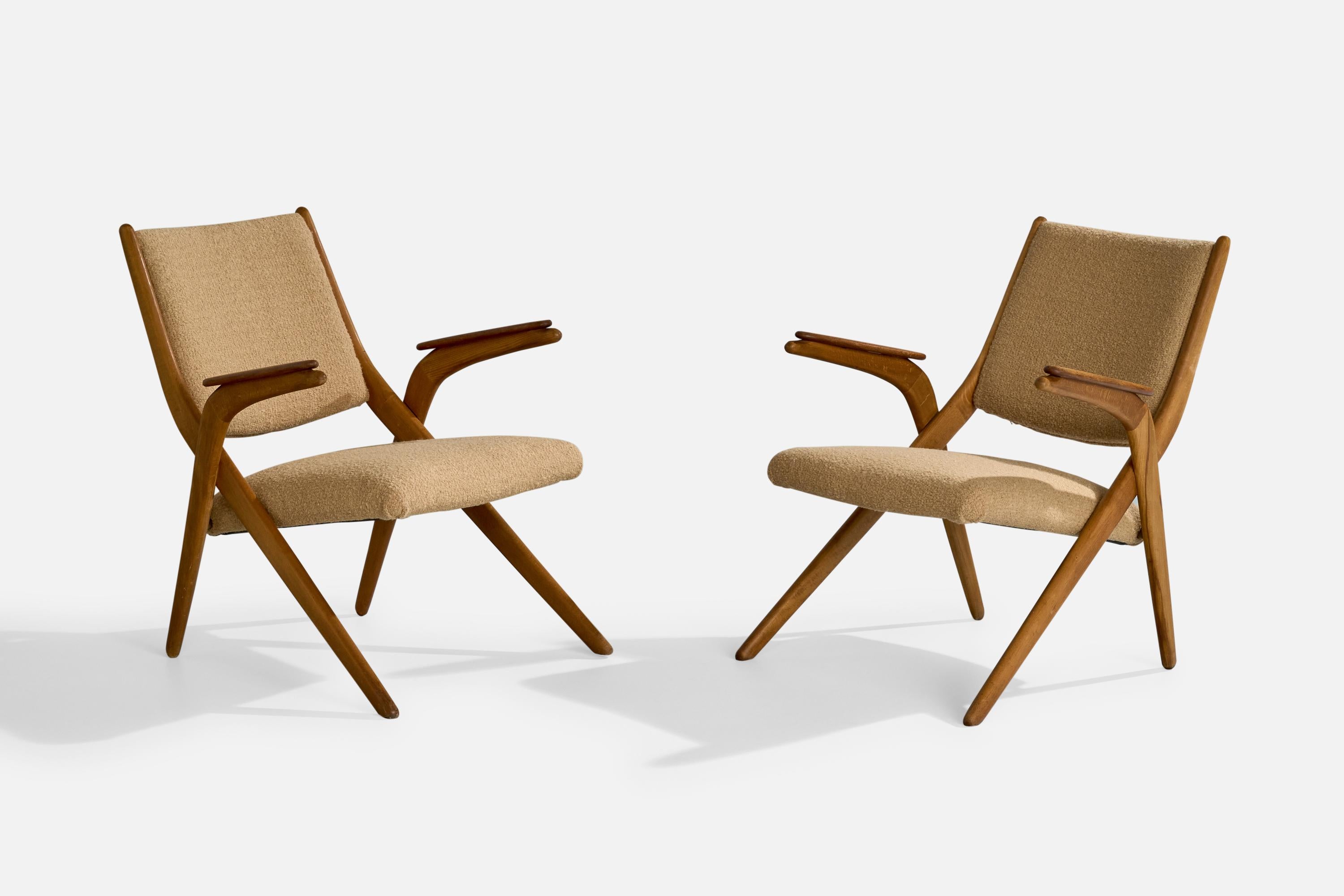 A pair of wood and beige fabric lounge chairs designed and produced in Denmark, c. 1950s.

Reupholstered in brand new fabric.

Dimensions: 31.5” H x 25.8” W x 29” D

Seat Height: 16.5” 