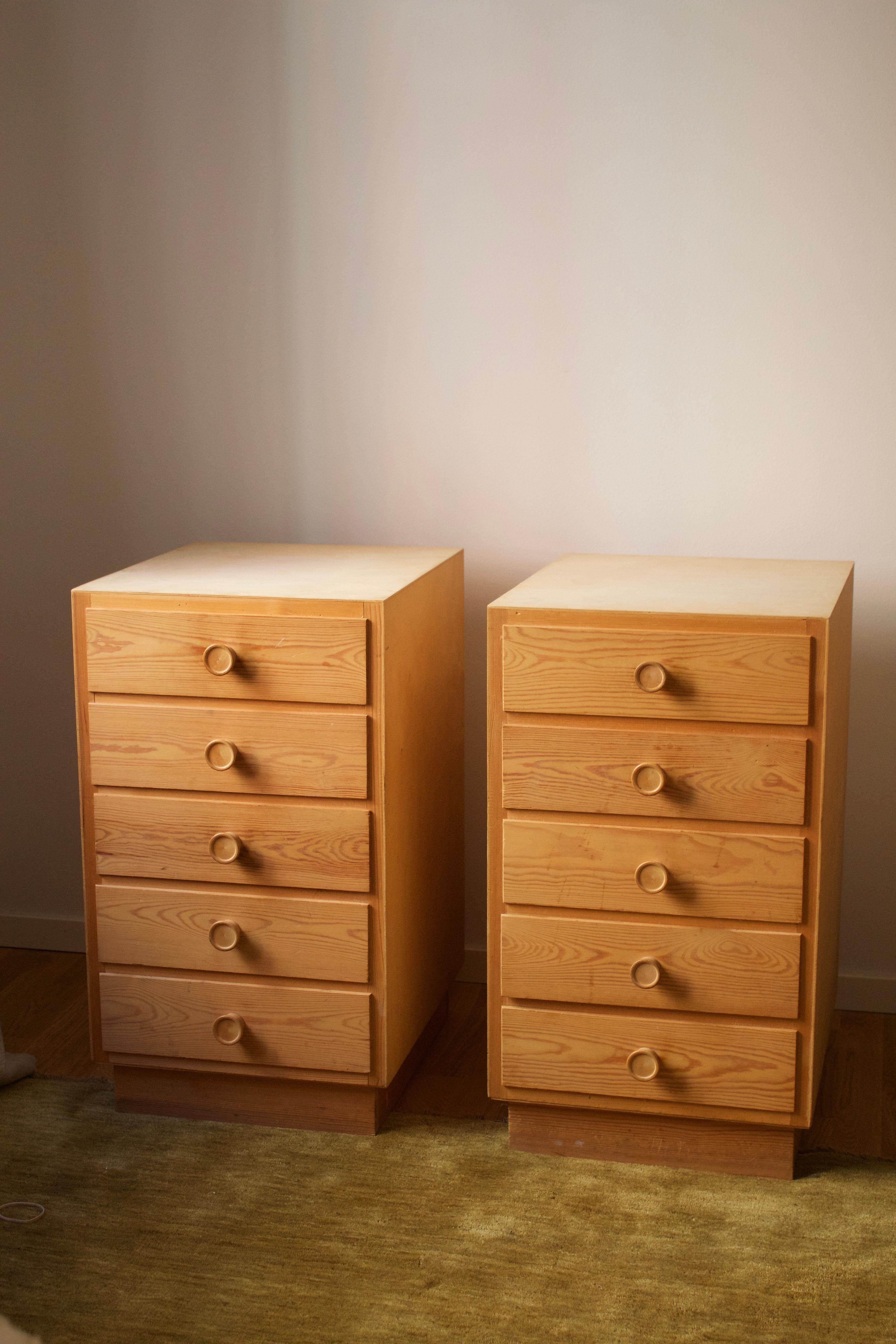 A pair of sizable nightstands / chests of drawers / bedside cabinets. In pine. Produced in Denmark, 1970s. 

Other designers of the period include Charlotte Perriand, Pierre Chapo, Roland Wilhelmsson, Kaare Klint, and Poul Kjaerholm.