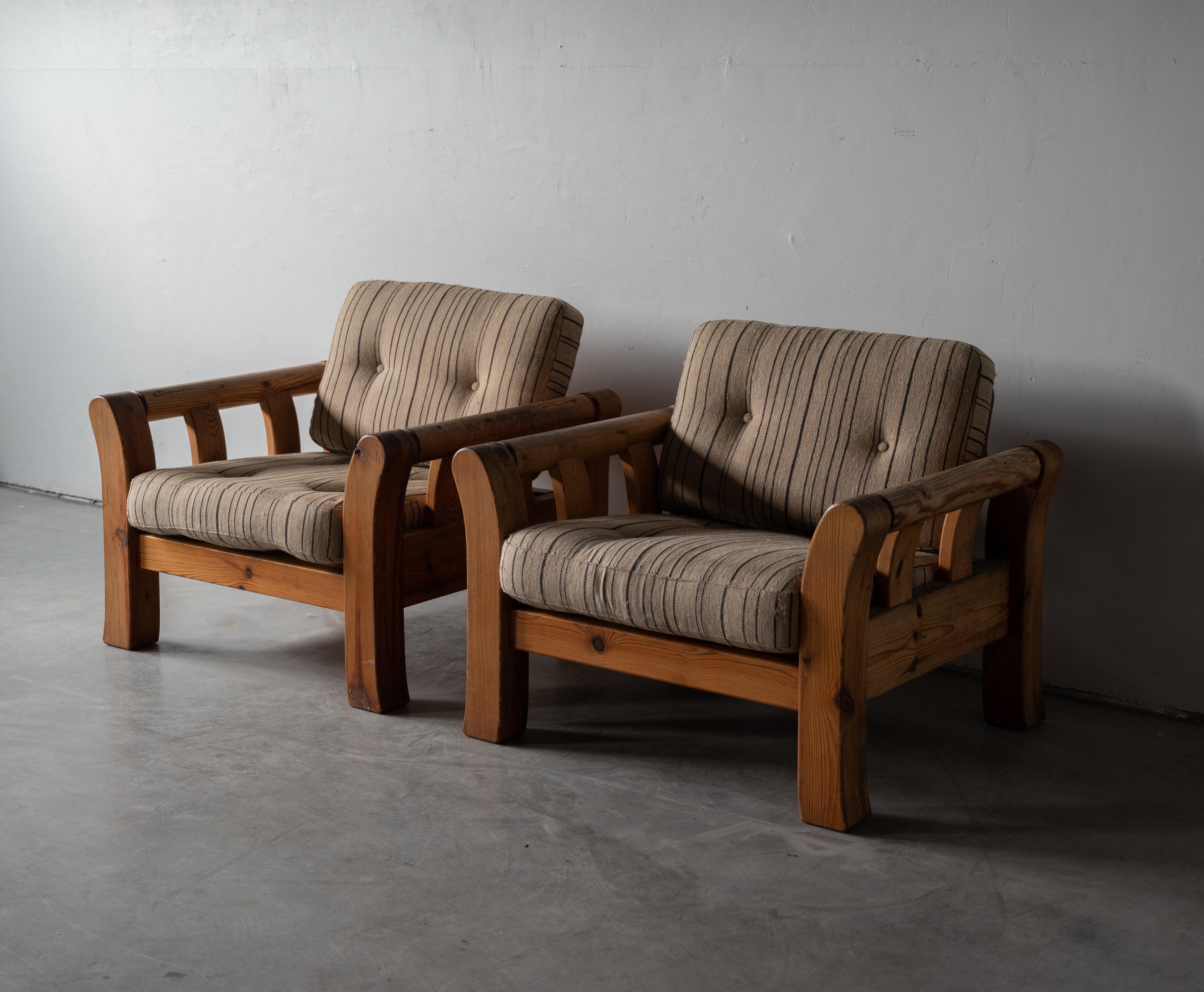 A pair of lounge chairs. Designed and produced in Denmark, 1970s. Solid pine and vintage fabric cushions.

Other designers of the period include Pierre Chapo, Axel Einar Hjorth, Charlotte Perriand, and George Nakashima.
