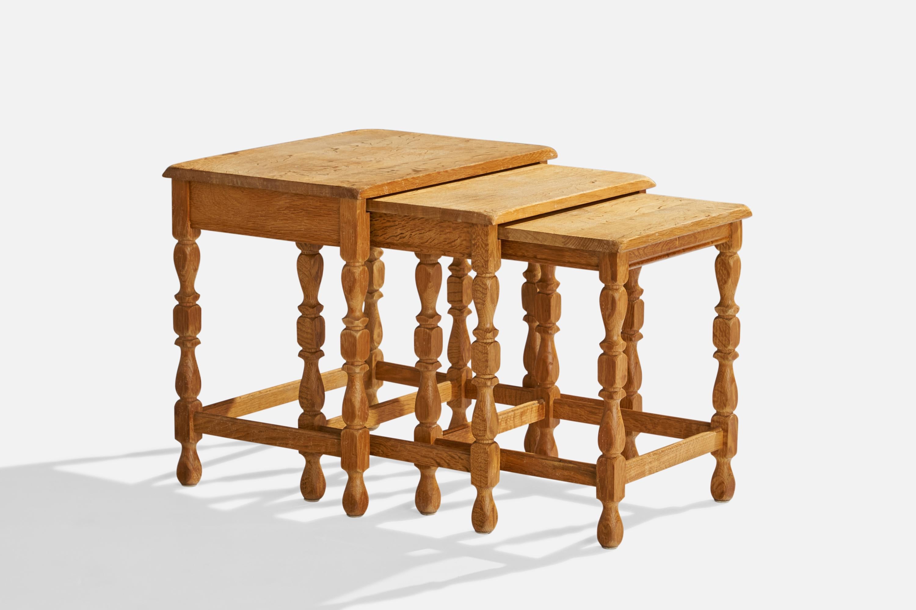 A set of 3 oak nesting tables designed and produced in Denmark, c. 1930s.

Second table measurements 19.75” H x 18.5” W x 15.5” D
Third table measurements 18.75” H x 15.5” W x 15.5” D