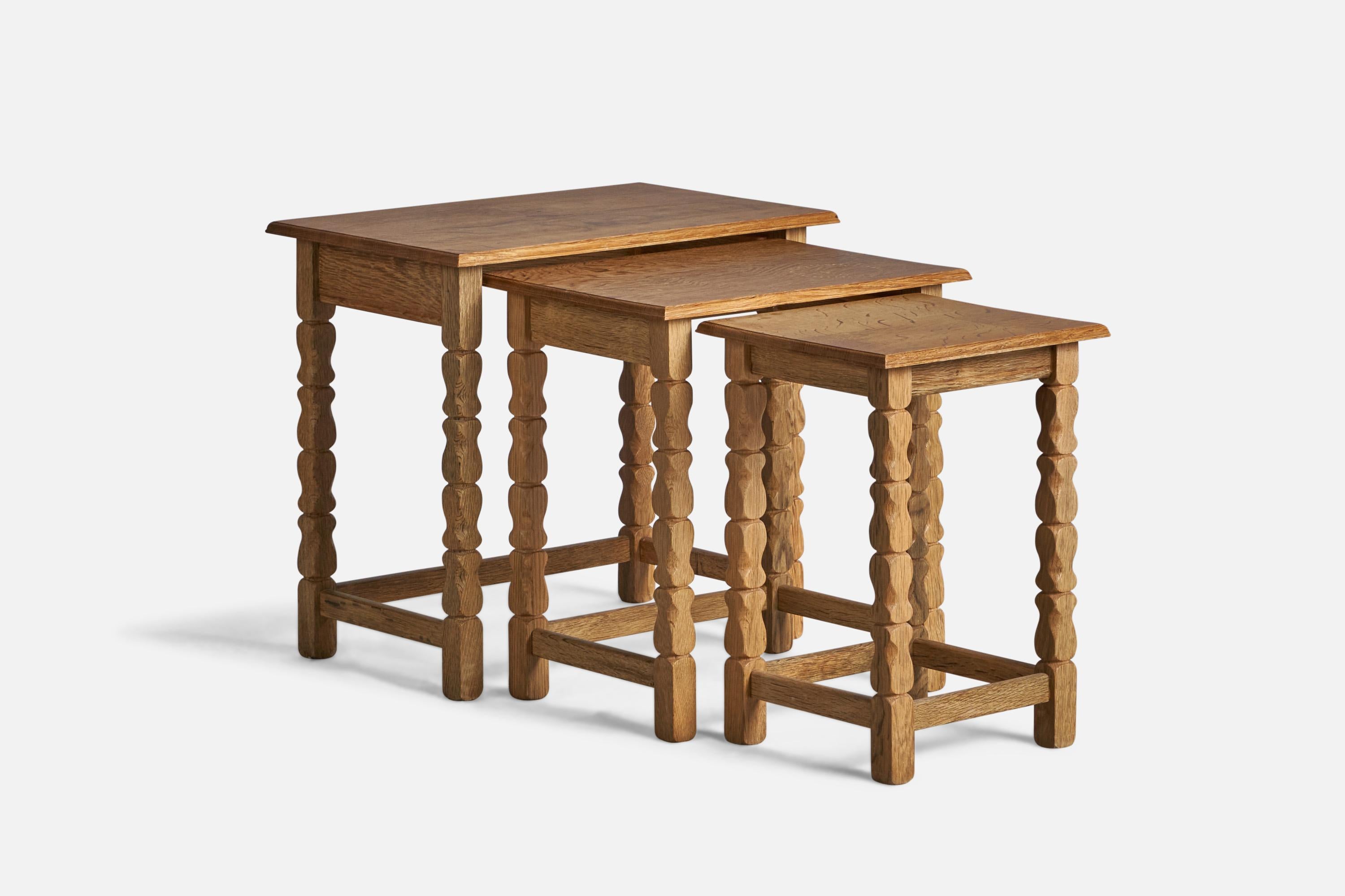 A set of 3 oak nesting tables designed and produced in Denmark, 1960s.

Smallest Dimensions: 17.5