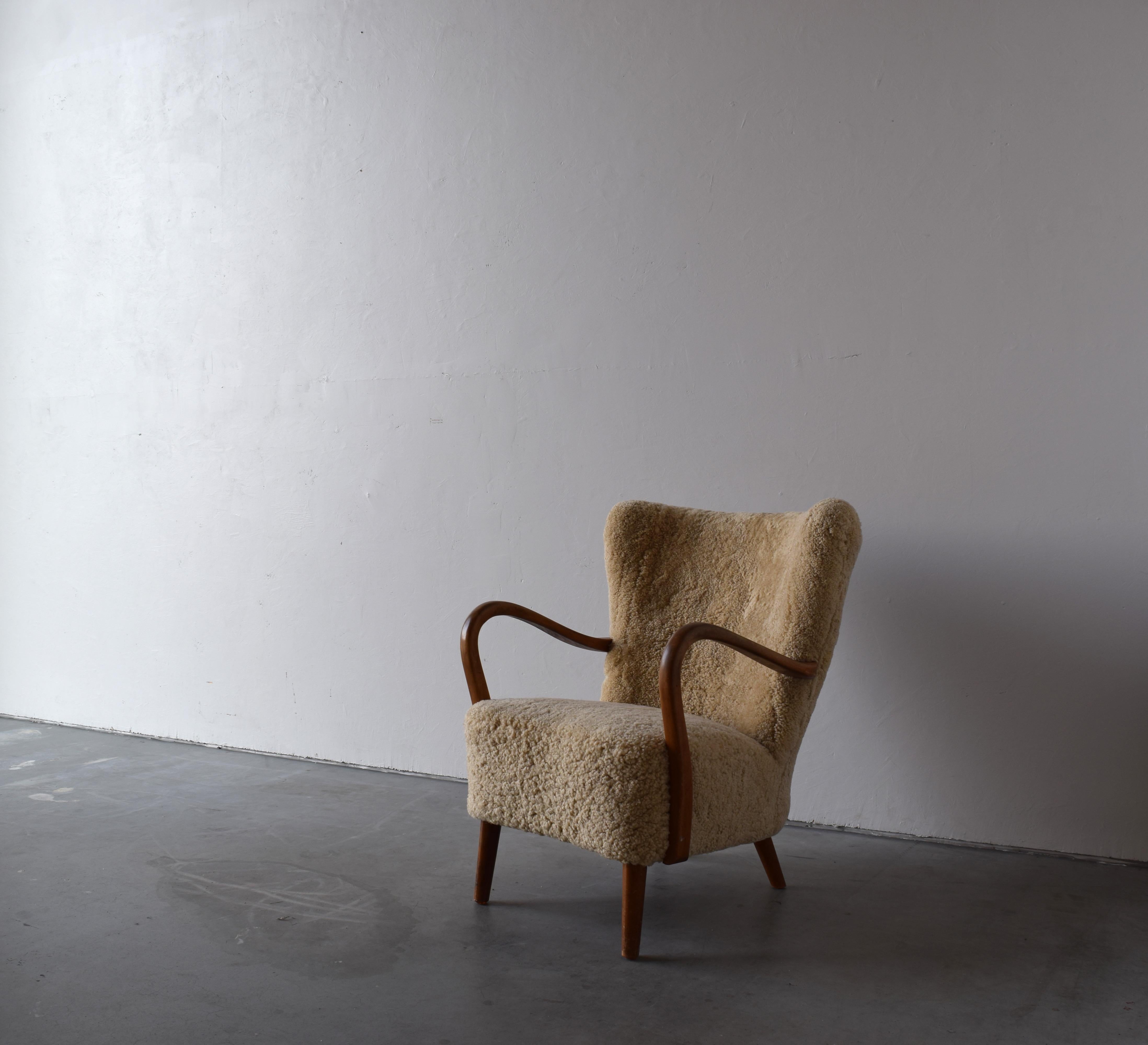 Mid-20th Century Danish Designer, Organic Lounge Chair, Sheepskin, Wood, Denmark, 1940s