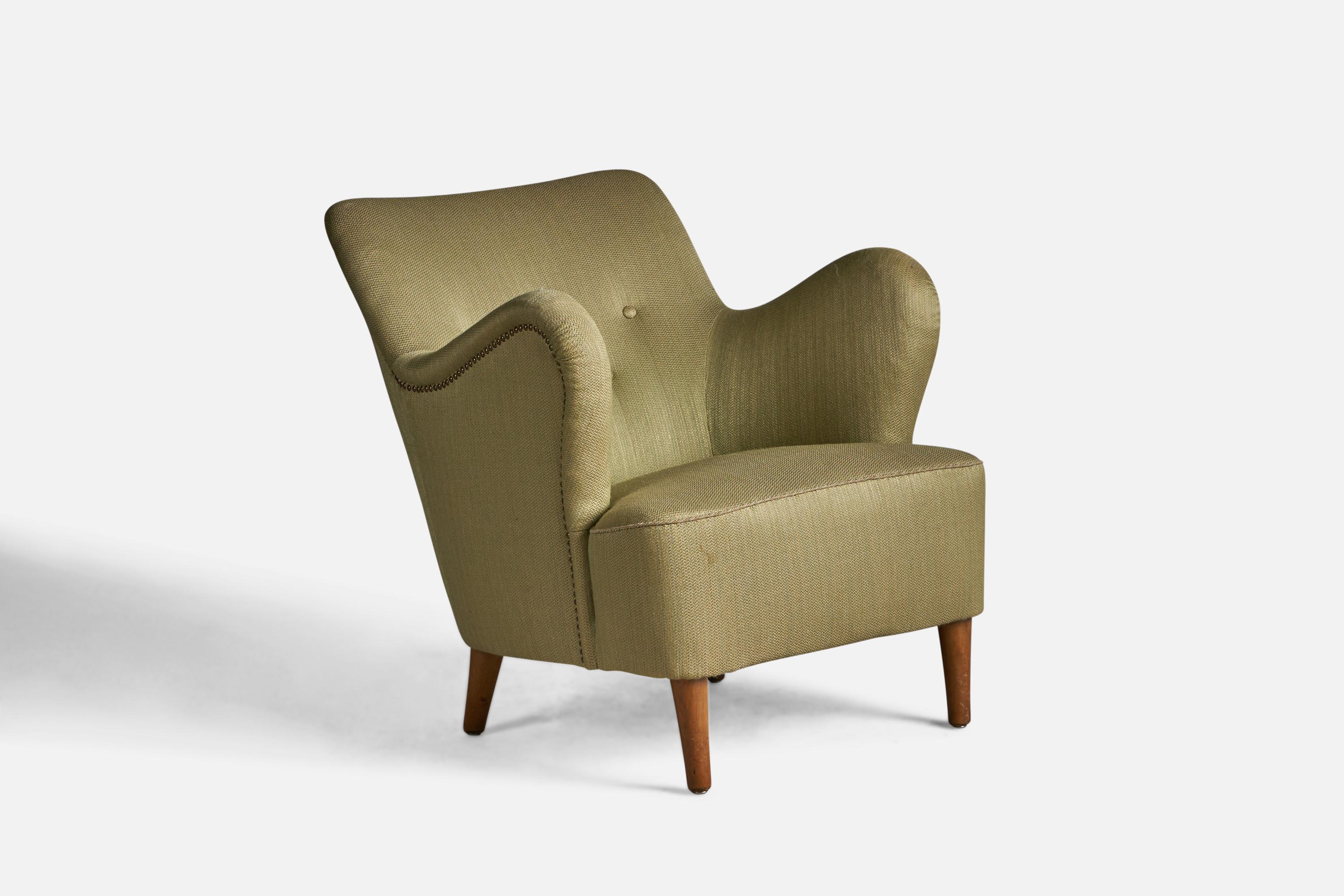An organic wood and green fabric lounge chair, designed and produced in Denmark, 1940s.

15.5