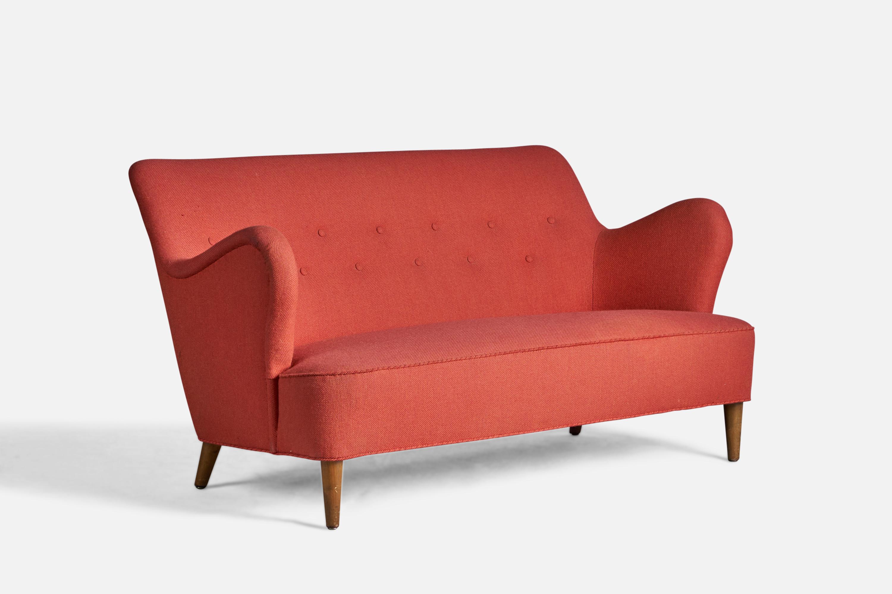 An organic wood and red fabric sofa, designed and produced in Denmark, 1940s.

15