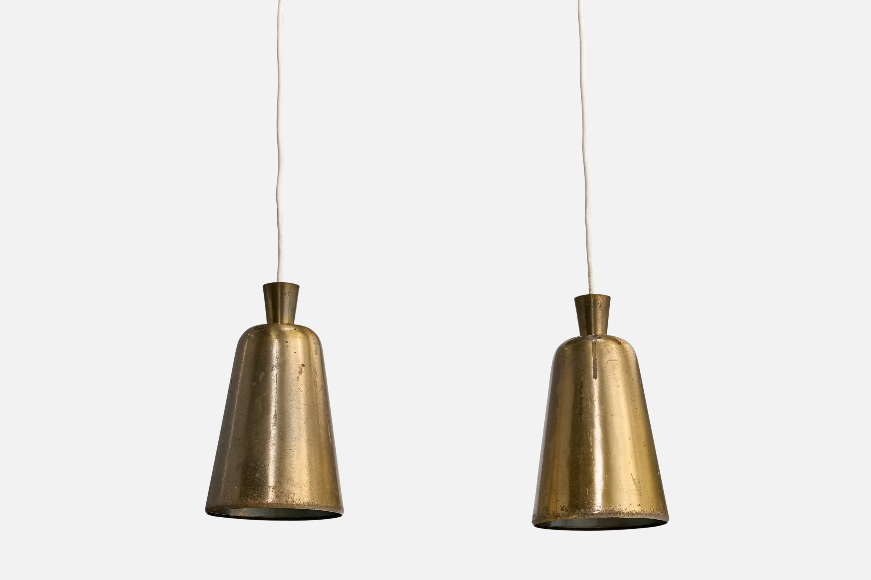 A pair of brass pendant lights designed and produced in Denmark, c. 1930s.

Overall Dimensions (inches): 48.5” H x 6.825” Diameter

Canopy not included.

Cord length: 37” H

Bulb Specifications: E-26

Number of Sockets: 1

All lighting will be