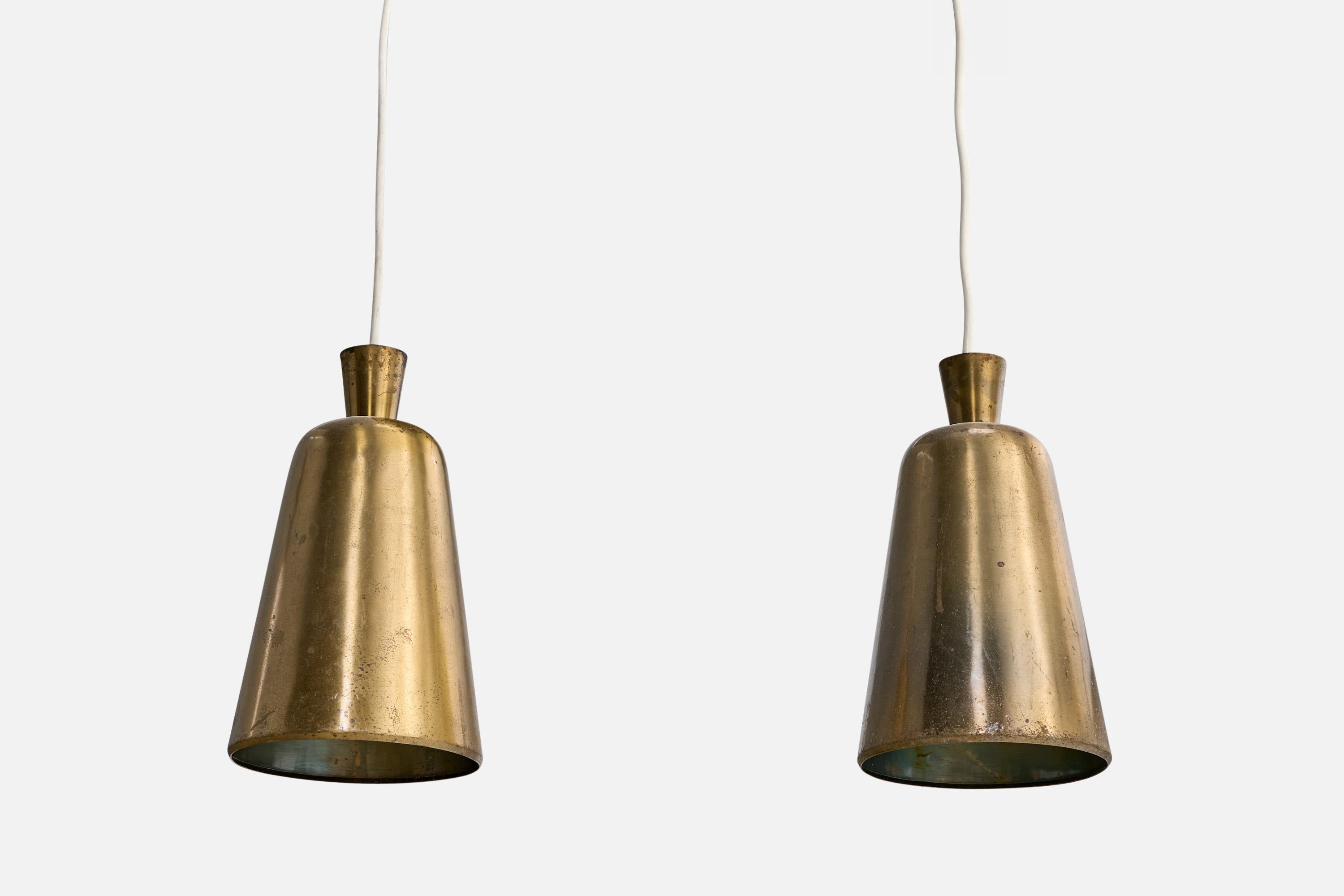 A pair of brass pendant lights designed and produced in Denmark, c. 1930s.

Overall Dimensions (inches): 32” H x 6.825” Diameter

Canopy not included.

Cord length: 21” H

Bulb Specifications: E-26

Number of Sockets: 1

All lighting will be