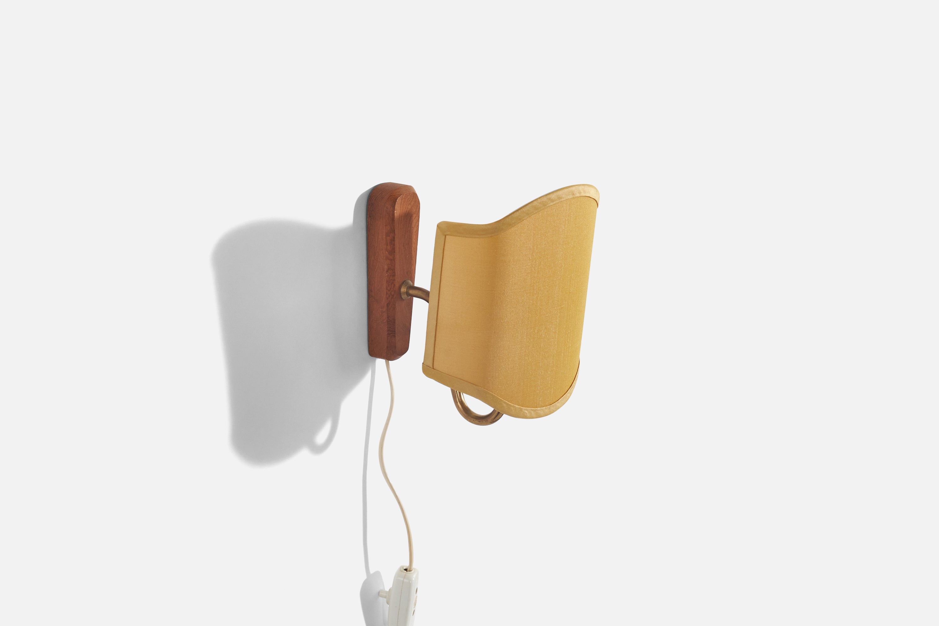 A brass, teak and fabric sconce designed and produced in Denmark, 1950s. 

Sold with Lampshade. 
Stated dimensions refer to the Sconce with the Shade. 
Dimensions of back plate (inches) : (5.87 x 1.81 x .93).