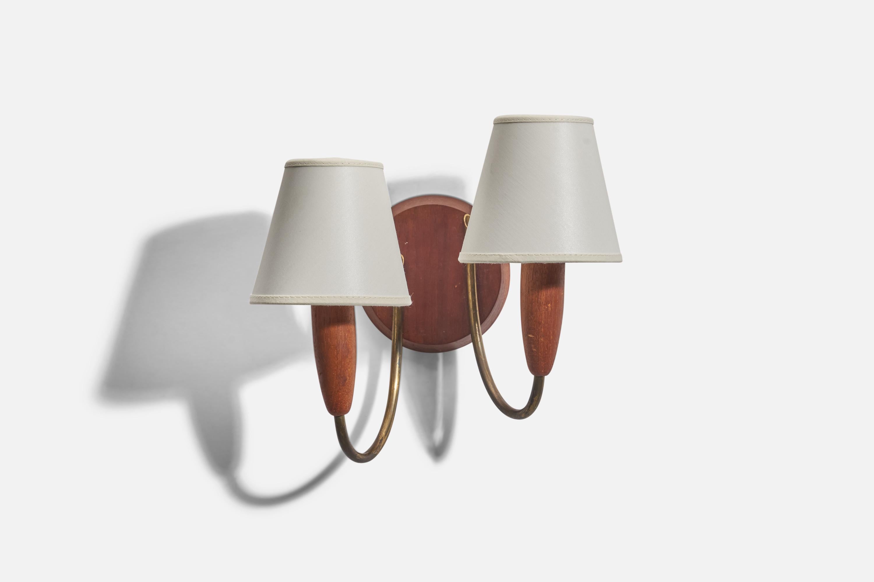 A teak, brass and fabric sconce designed and produced in Denmark, 1950s.

Sold with Lampshades. Dimensions stated are of Sconce with Lampshades.

Dimensions of Back Plate (inches) : 4.56 x 4.56 x 0.68 (Height x Width x Depth)

Sockets take