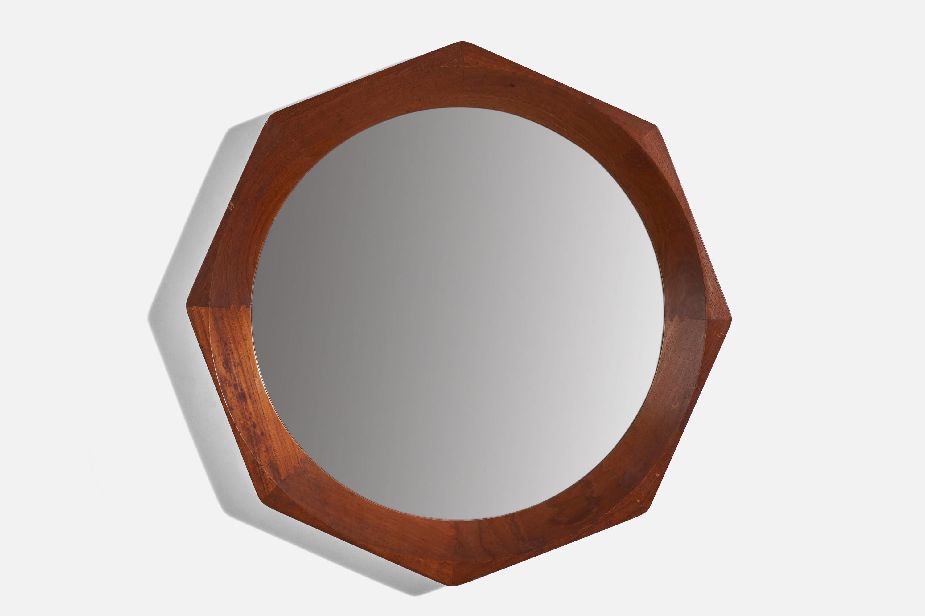 A Danish rosewood mirror. Designed and produced in Denmark, 1950s. Features a sculptural Octagonal rosewood frame, original mirror glass.

Stamped 