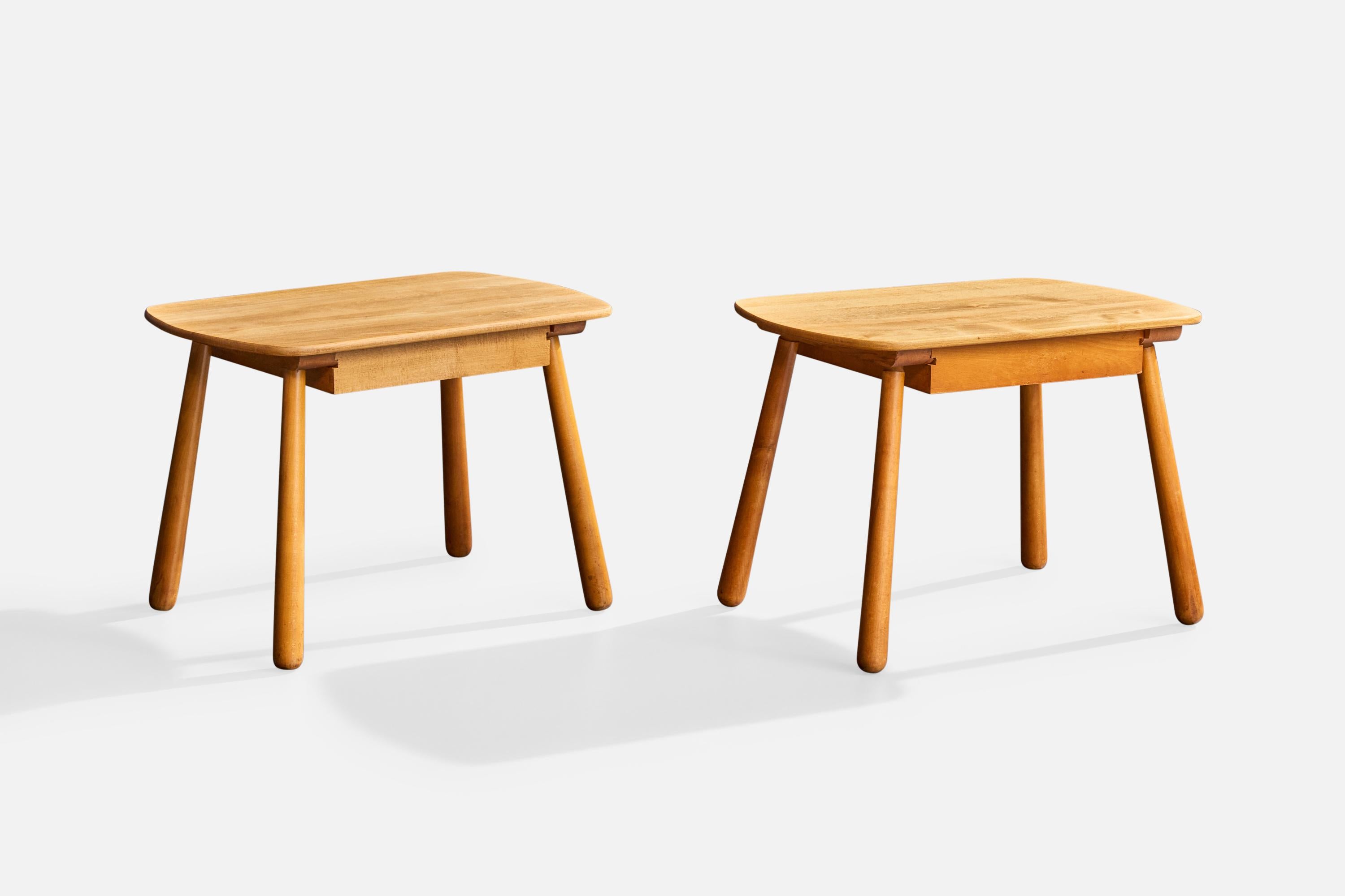 A pair of oak side tables or nightstands likely designed and produced in Denmark, c. 1950s.

Overall Dimensions (inches): 19.8