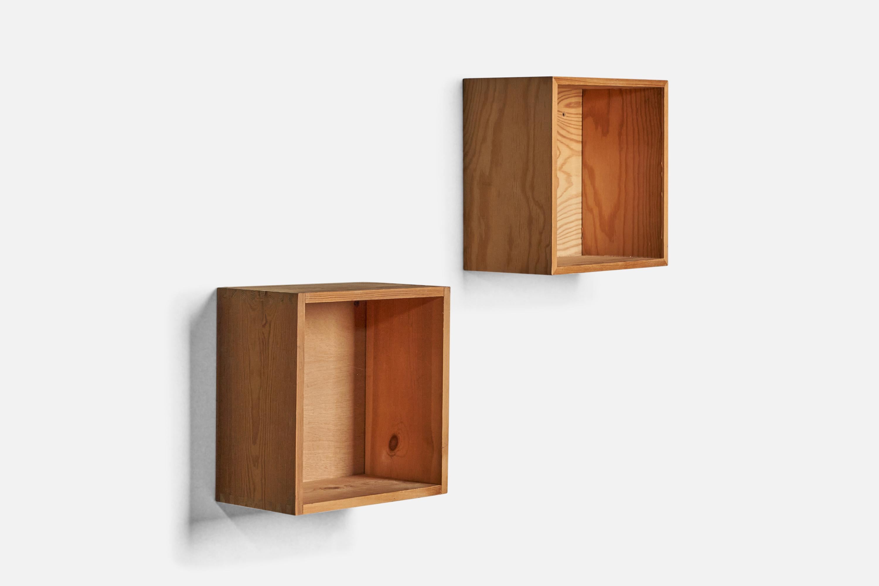 A pair of small wall-mounted pine cabinets or nightstands designed and produced in Denmark, 1970s.

One is 7” H, making it 0.5” taller than the other.