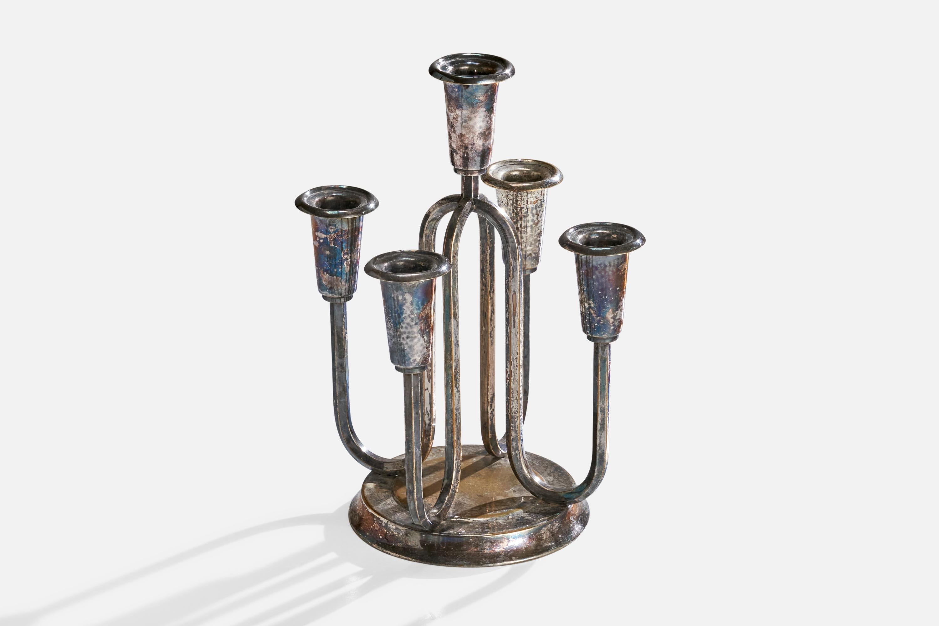 A small silver plate candelabra designed and produced in Denmark, c. 1940s.

Dimensions: 10.75” H x 8.5” diameter 

Holds 1” diameter candles