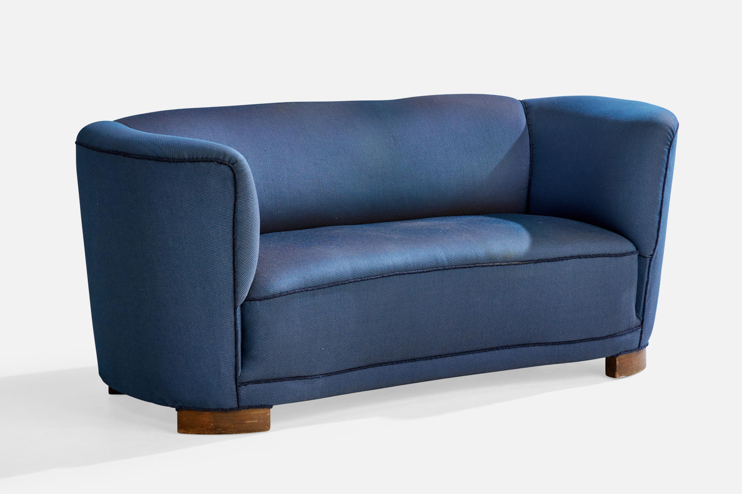 A blue fabric and wood sofa designed and produced in Denmark, c. 1940s.

Overall Dimensions (inches): 28.0