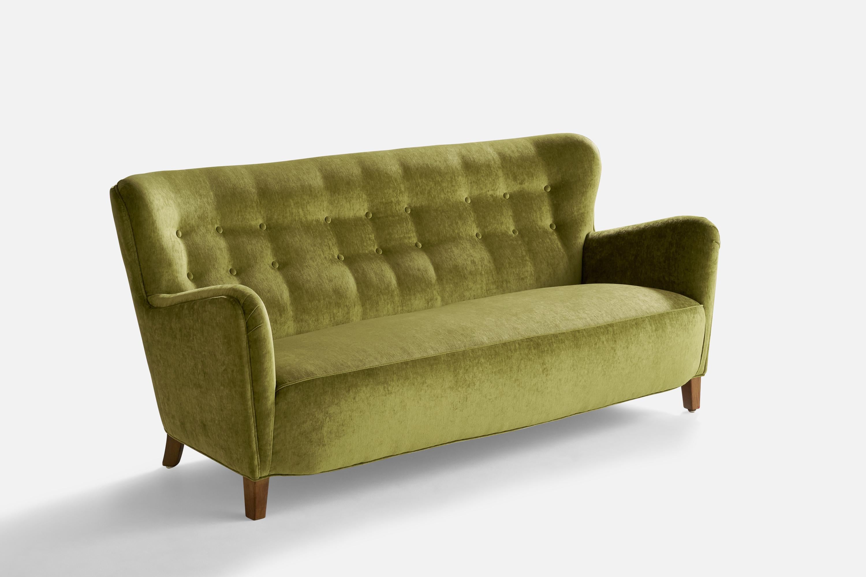 A green velvet and wood sofa designed and produced in Denmark, 1940s.

Seat height: 14.75”