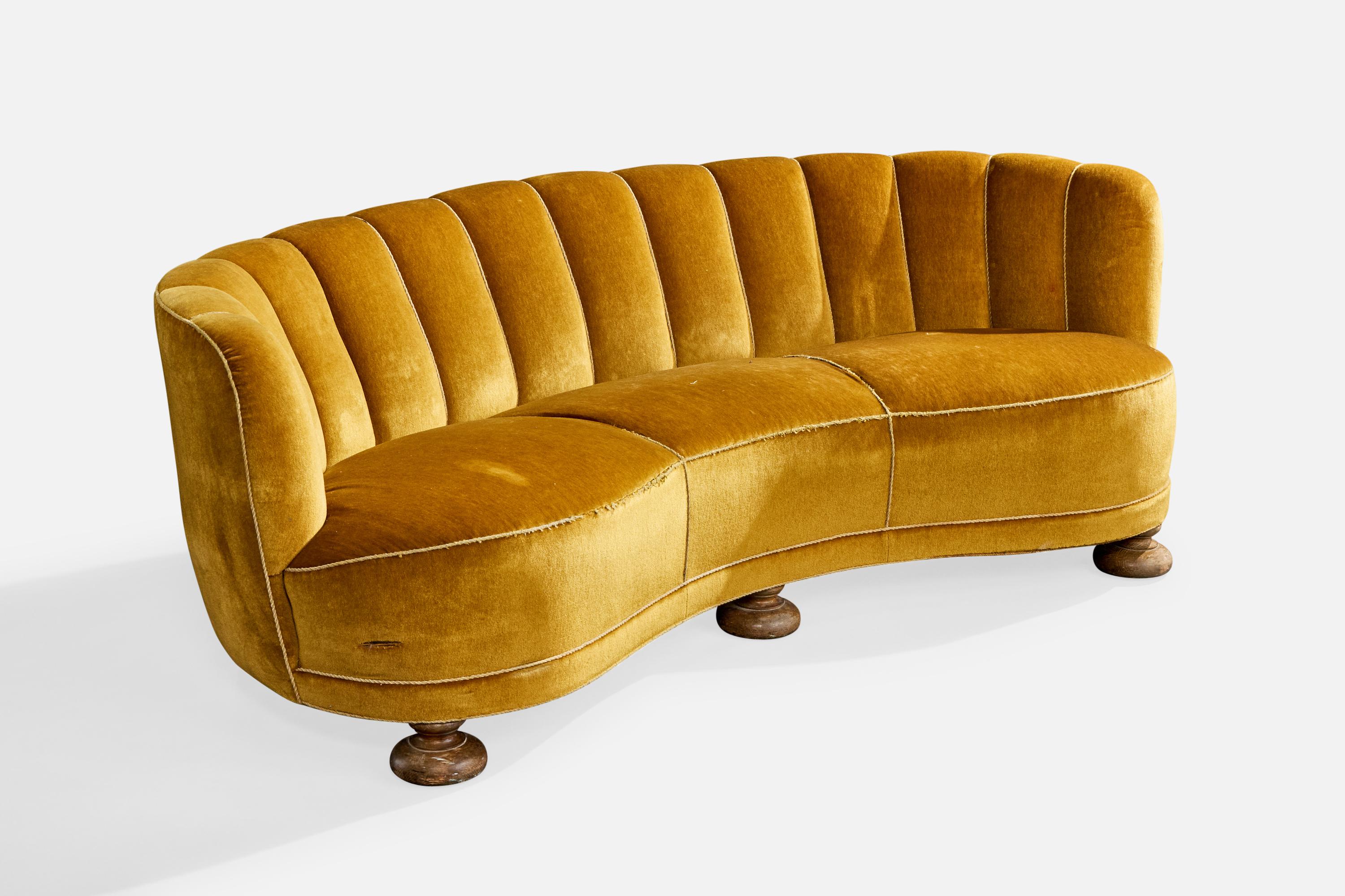 A yellow velvet and dark-stained wood sofa designed and produced in Denmark, c. 1940s.

Vintage fabric in distressed condition, reupholstery recommended.

Overall Dimensions (inches): 27.5