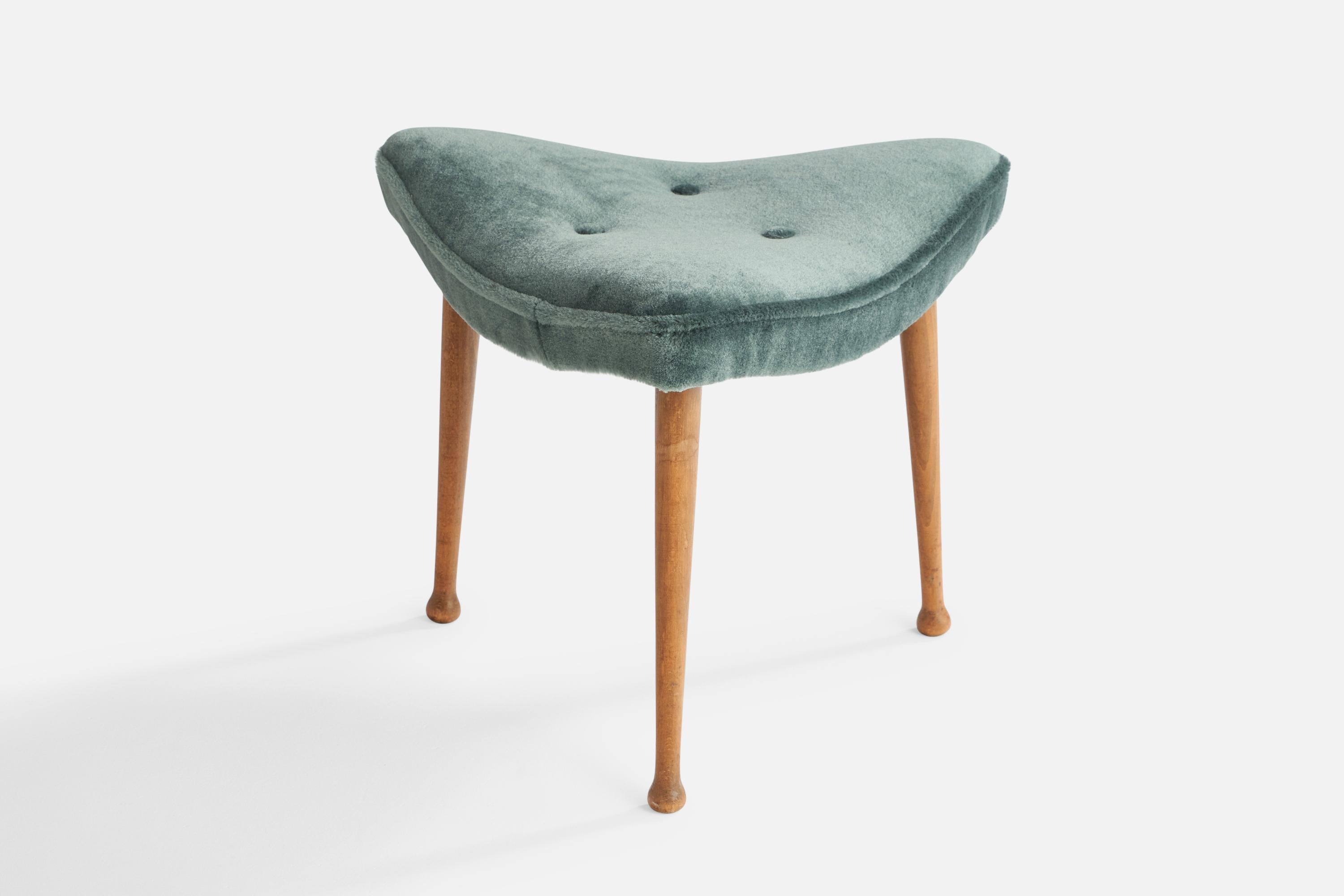 An oak and blue mohair stool designed and produced in Denmark, 1950s.

Seat height: 16.5”