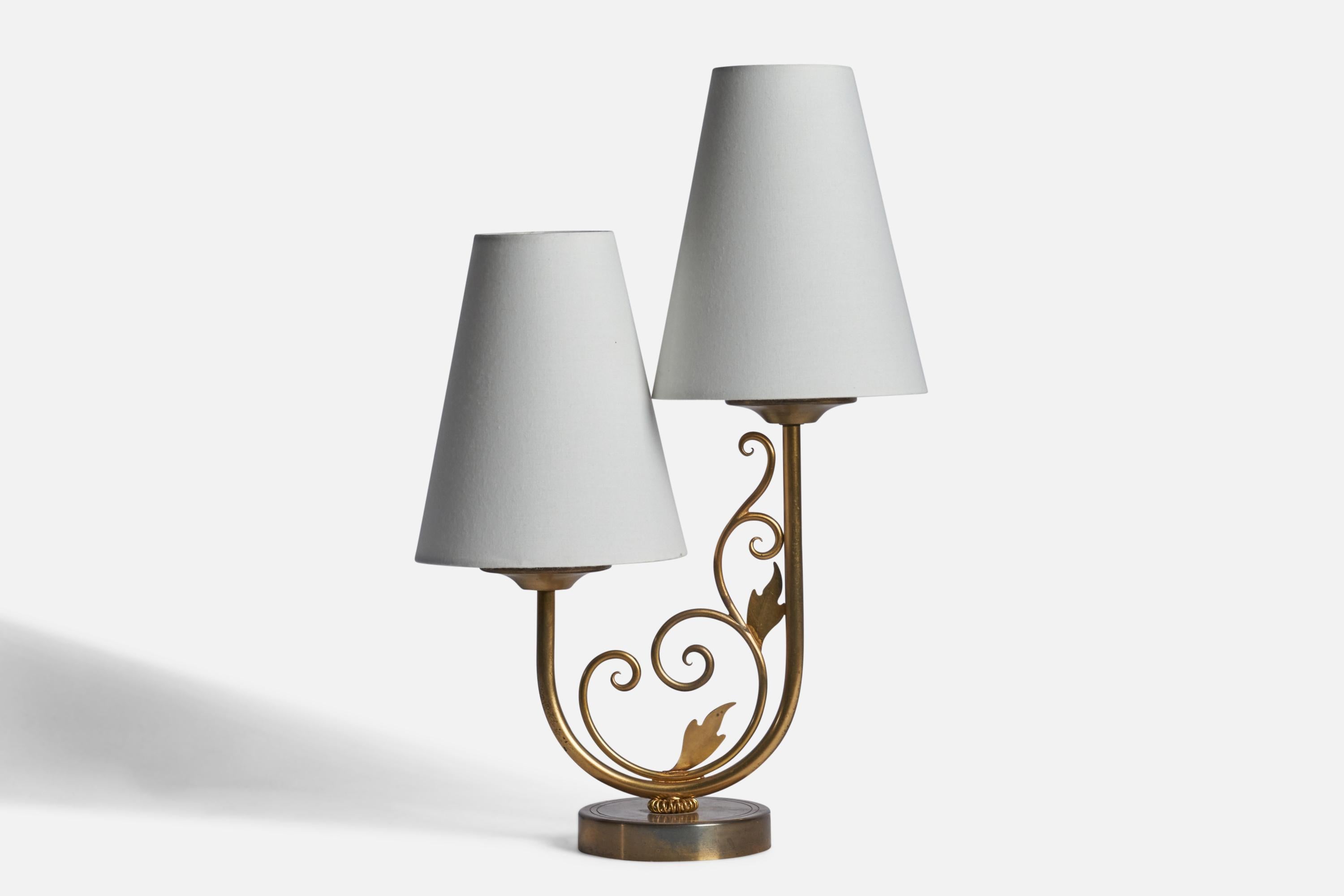 
A two-armed brass and white fabric table lamp designed and produced in Denmark, 1940s.
Overall Dimensions (inches): 15.65