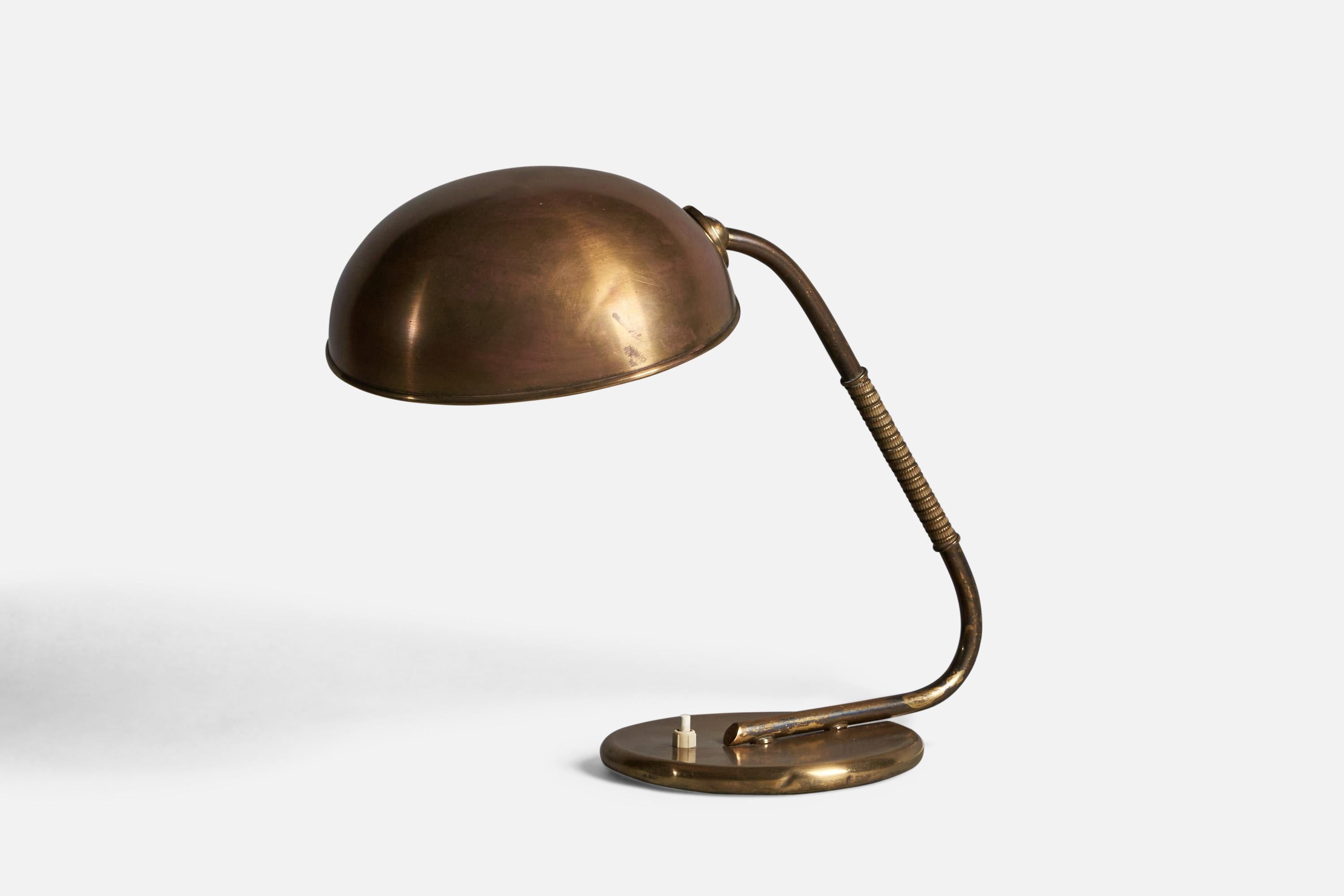 An adjustable brass and metal table lamp, designed and produced in Denmark, c. 1940s.

Overall Dimensions (inches): 14.25