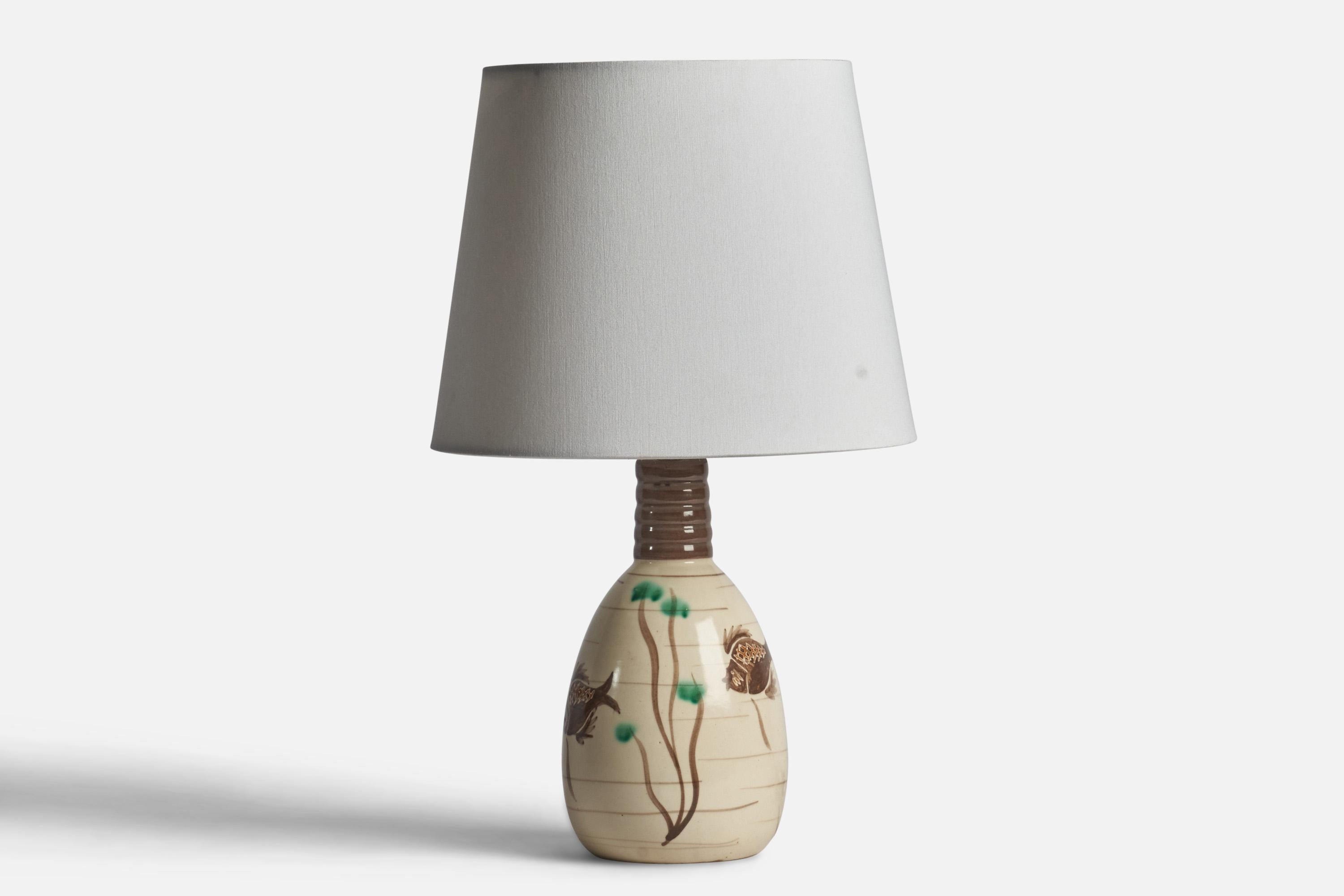 A hand-painted off-white and brown table lamp designed and produced in Denmark, c. 1940s.

“Terra Danica 590 AF” stamp on bottom.

Dimensions of Lamp (inches): 11.5” H x 5” Diameter
Dimensions of Shade (inches): 7.5” Top Diameter x 10” Bottom