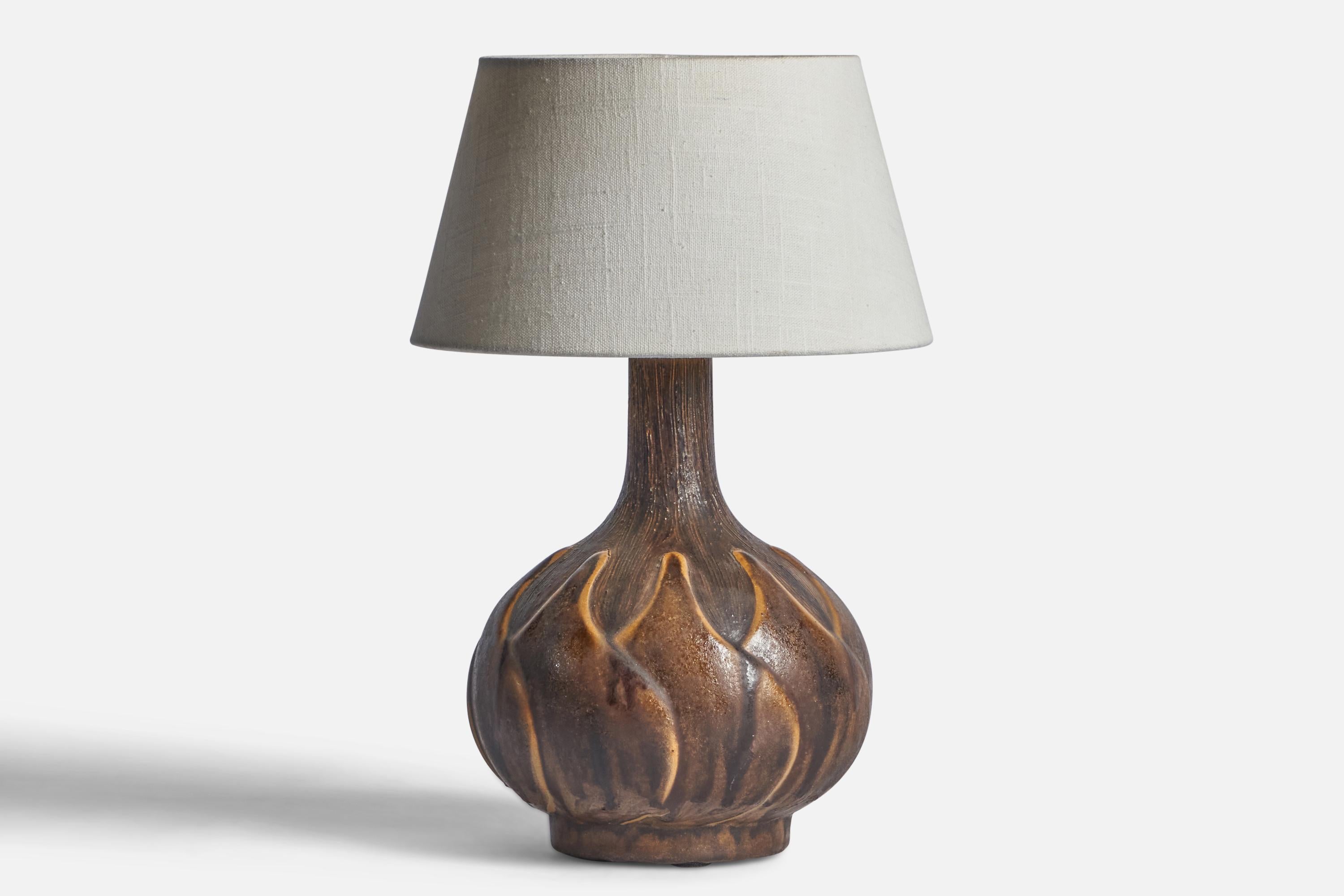 A brown-glazed ceramic table lamp designed and produced in Denmark, 1960s.

Dimensions of Lamp (inches): 12.35” H x 7.7” Diameter
Dimensions of Shade (inches): 7” Top Diameter x 10” Bottom Diameter x 5.5” H 
Dimensions of Lamp with Shade (inches):