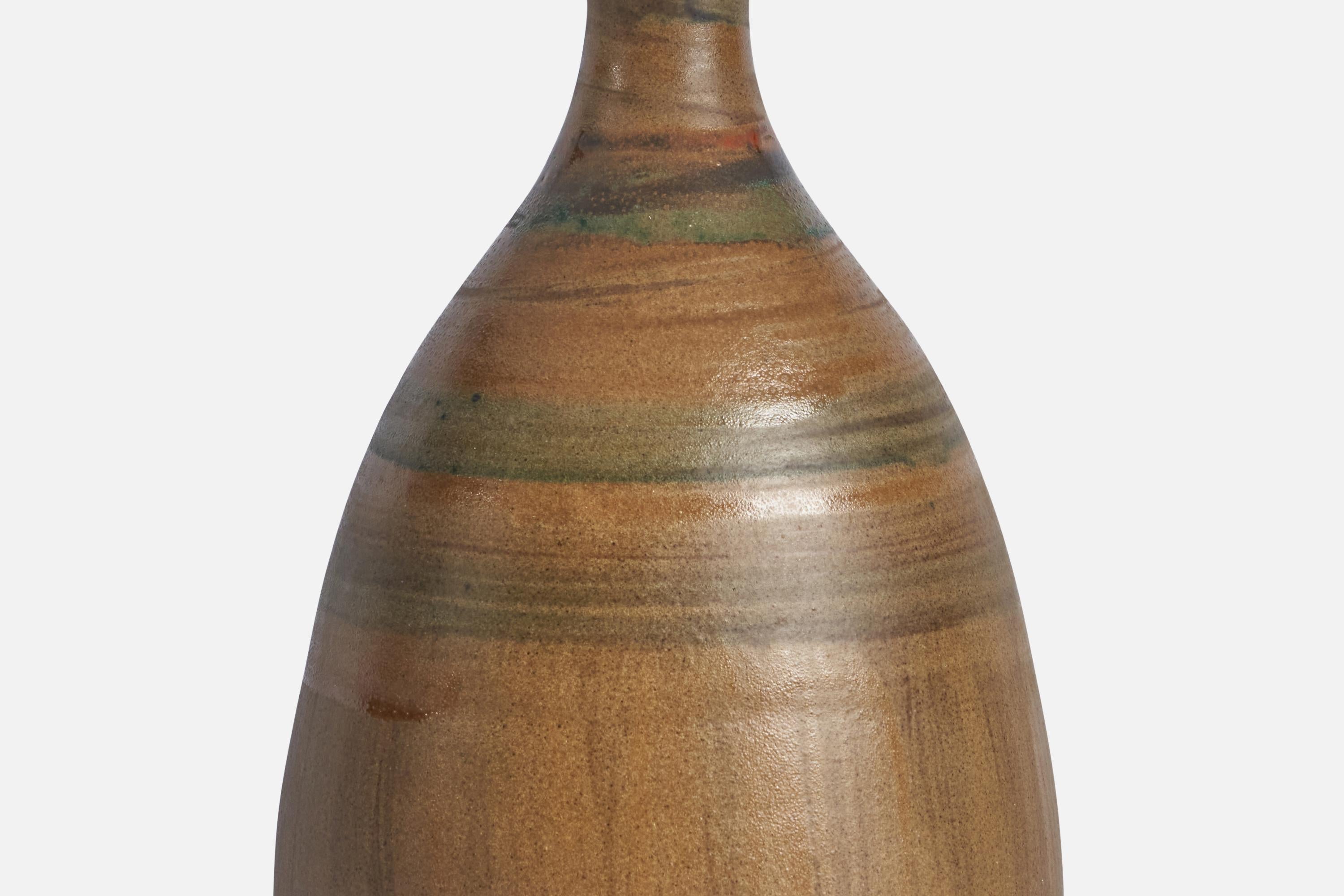 A brown and green-glazed ceramic table lamp designed and produced in Denmark, 1960s.

Dimensions of Lamp (inches): 14” H x 6.25” Diameter
Dimensions of Shade (inches): 4.5” Top Diameter x 16” Bottom Diameter x 7.15” H 
Dimensions of Lamp with Shade