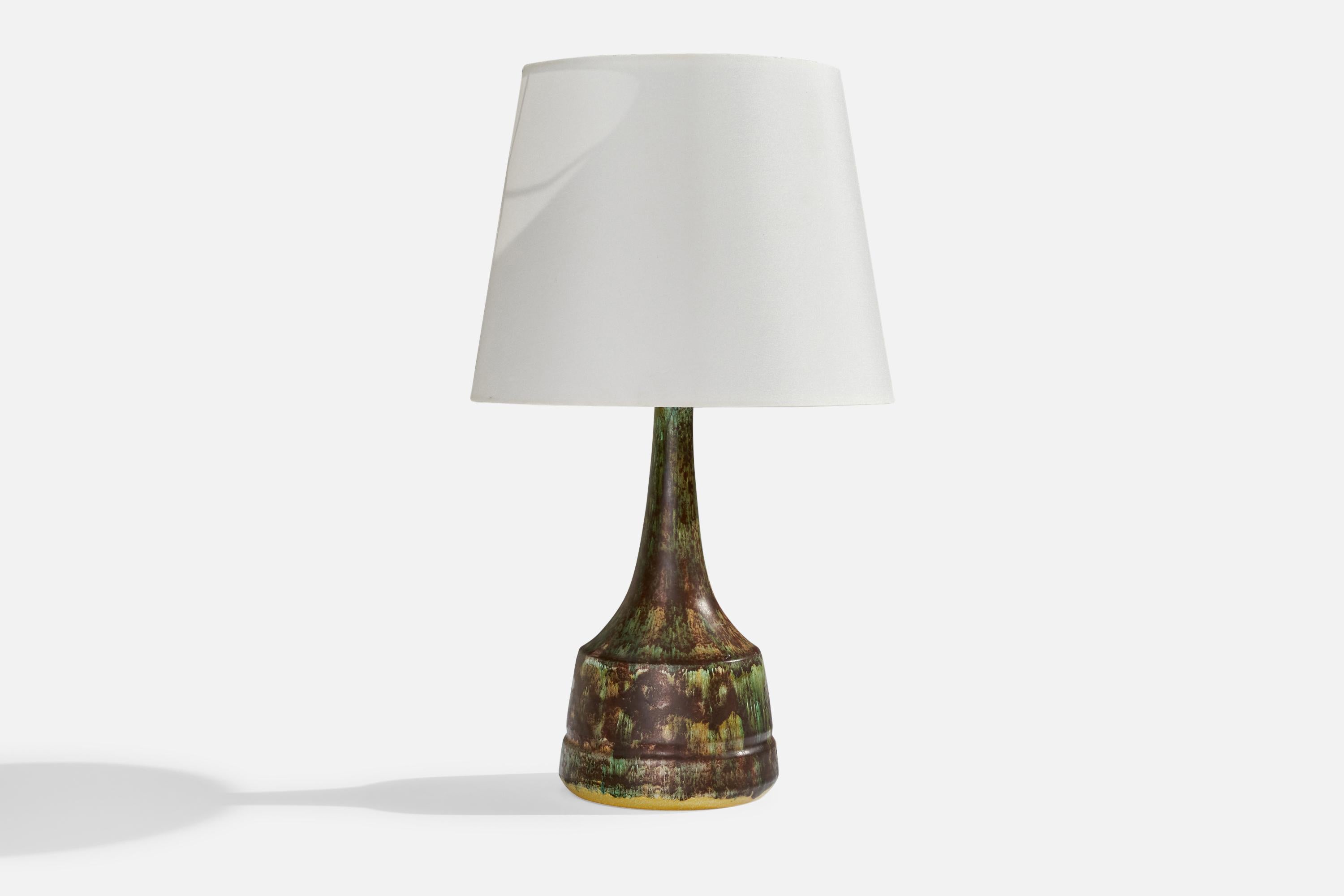A green and brown-glazed ceramic table lamp designed and produced in Denmark, c. 1960s. 

Dimensions of Lamp (inches): 12”  H x 5.4” Diameter
Dimensions of Shade (inches): 7.5”  Top Diameter x 10”  Bottom Diameter x 8” H
Dimensions of Lamp with