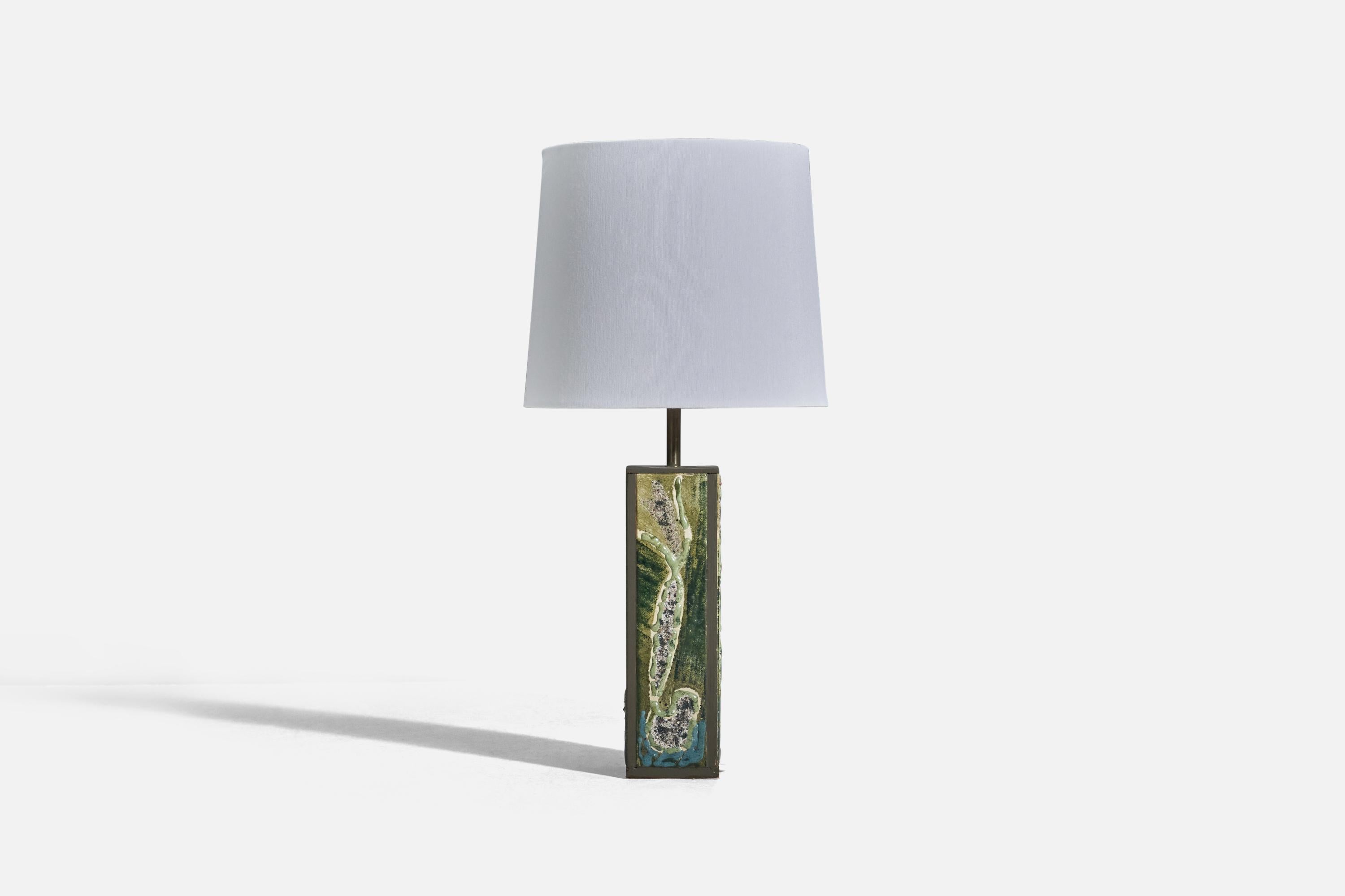A green glazed stoneware and metal table lamp designed and produced in Denmark, 1950s. 

Sold without lampshade
Dimensions of lamp (inches) : 12.5 x 2.55 x 2.55 (Height x Width x Depth)
Dimensions of lampshade (inches) : 7 x 8 x 7 (Top Diameter