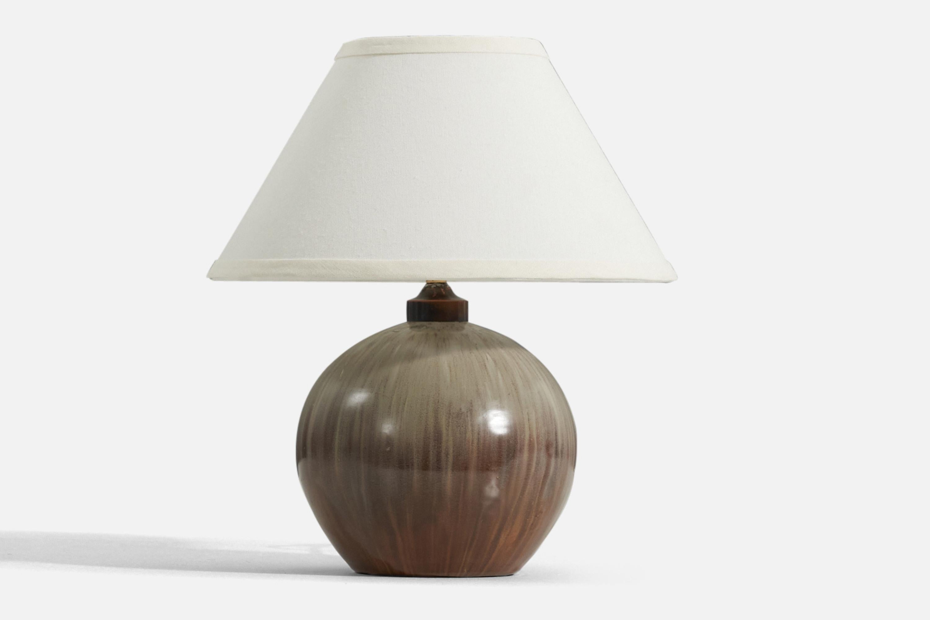 A brown and gray-glazed stoneware table lamp, designed and produced in Denmark, 1940s.

Measurements listed are of lamp. Sold without lampshade. Below dimensions for reference:

Shade : 5.25 x 12.25 x 7.25
Lamp with shade : 13.5 x 12.25 x 12.25.