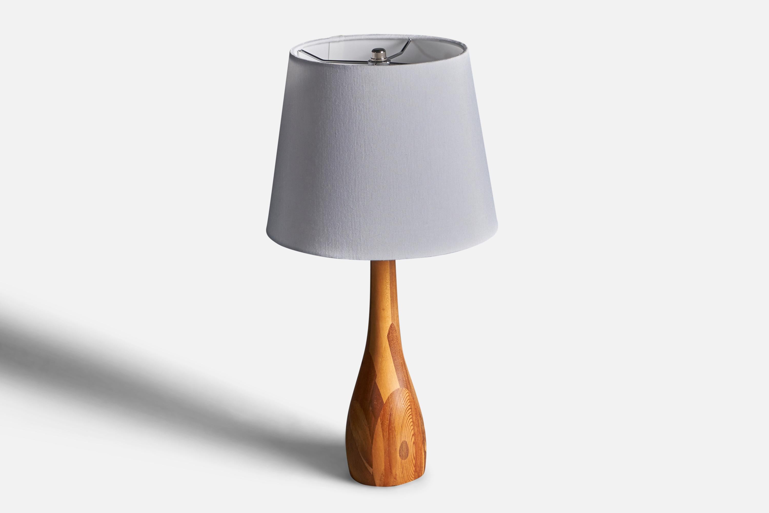 A table lamp. Designed and produced by unknown maker, Denmark, c. 1950s. Features solid woods such as pine, birch, walnut. Sold without lampshade.