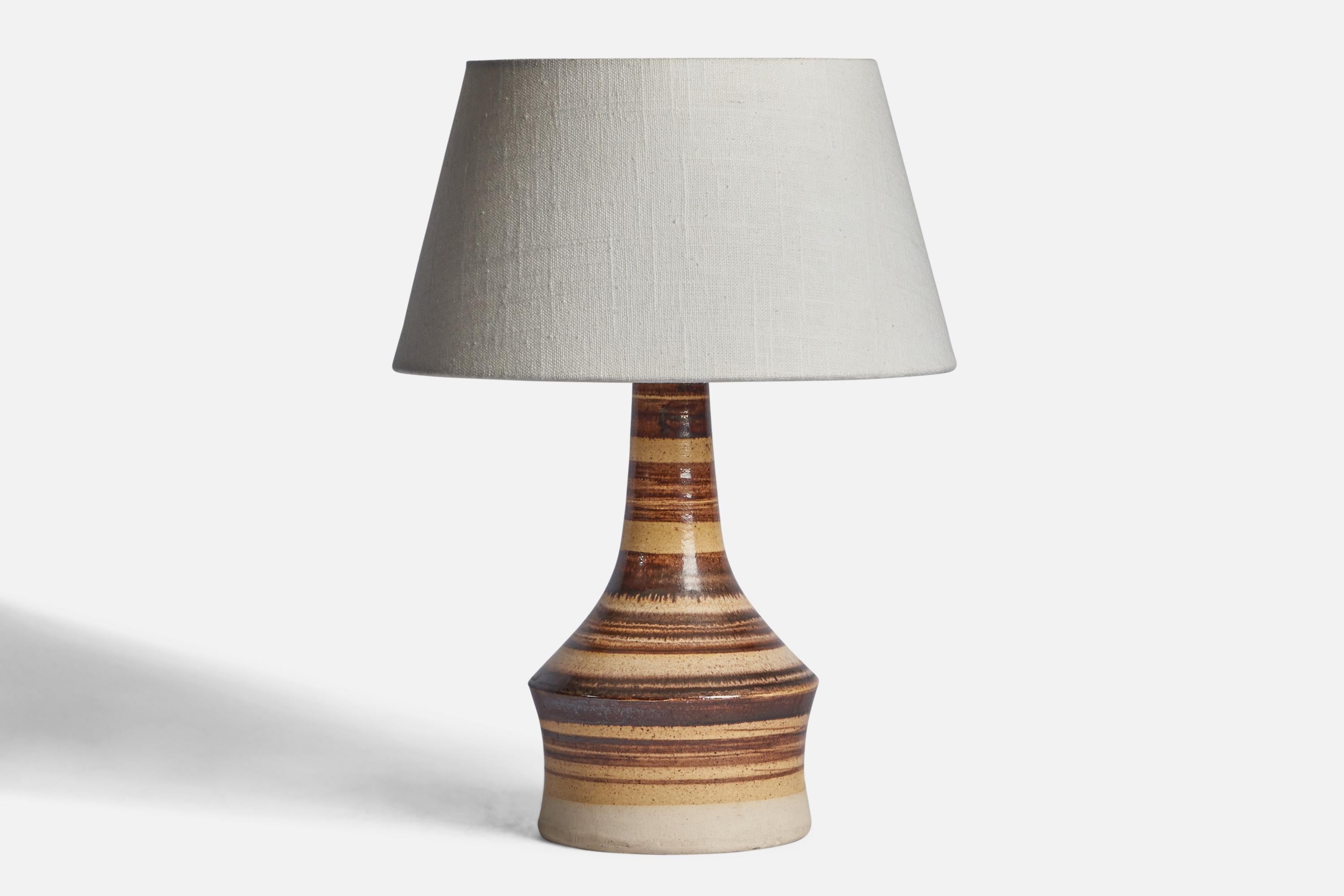 A brown and beige-painted stoneware table lamp designed and produced in Denmark, 1960s.

Dimensions of Lamp (inches): 10.75” H x 5.75” Diameter
Dimensions of Shade (inches): 7” Top Diameter x 10” Bottom Diameter x 5.5” H 
Dimensions of Lamp with