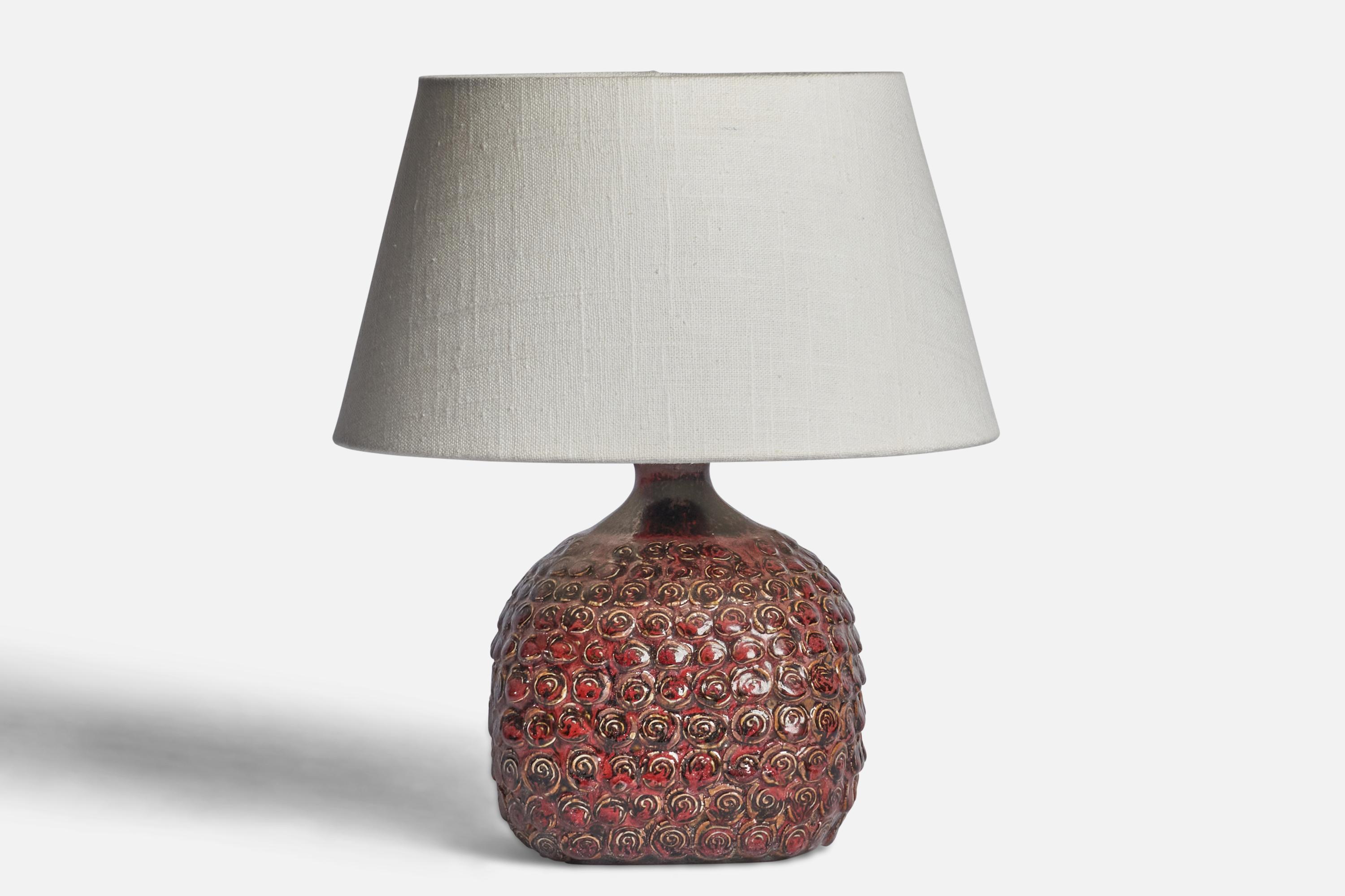 A red-glazed stoneware table lamp designed and produced in Denmark, c. 1960s.

Dimensions of Lamp (inches): 9