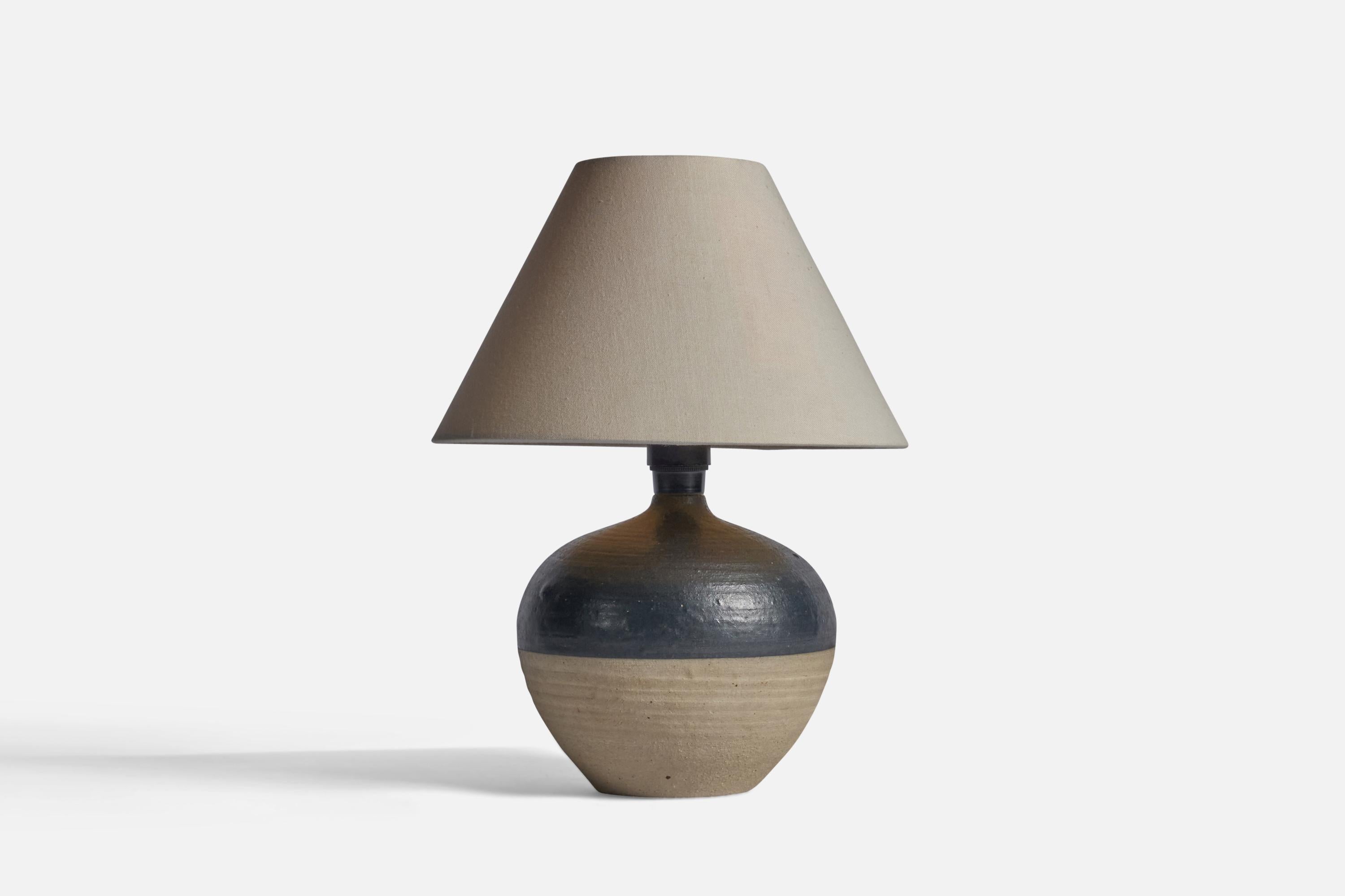 A black and grey-glazed stoneware and fabric table lamp, designed and produced in Denmark, 1960s.

Overall Dimensions (inches): 11