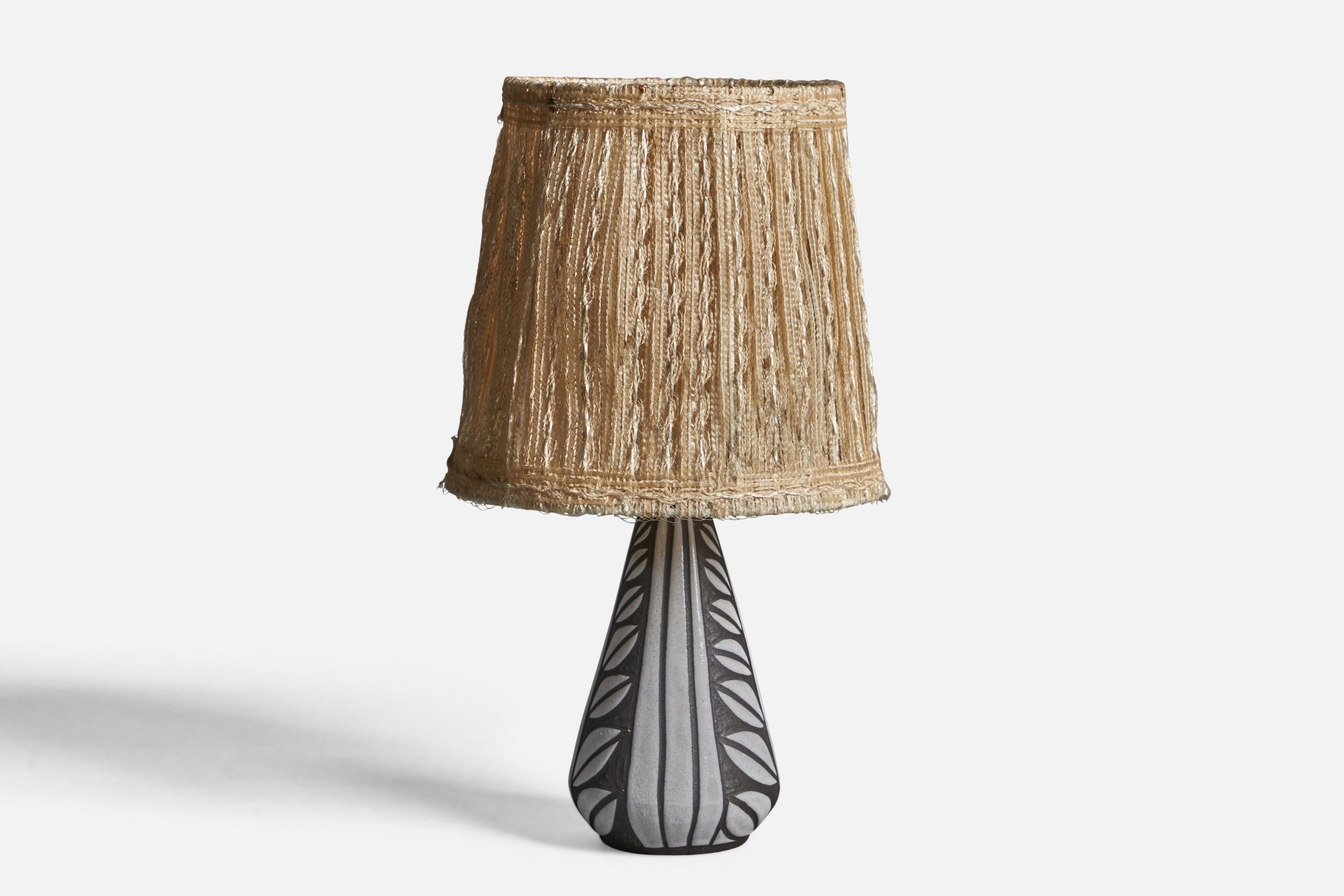 A grey stoneware and woven fabric table lamp, designed and produced in Denmark, 1960s.

Overall Dimensions (inches): 12.75