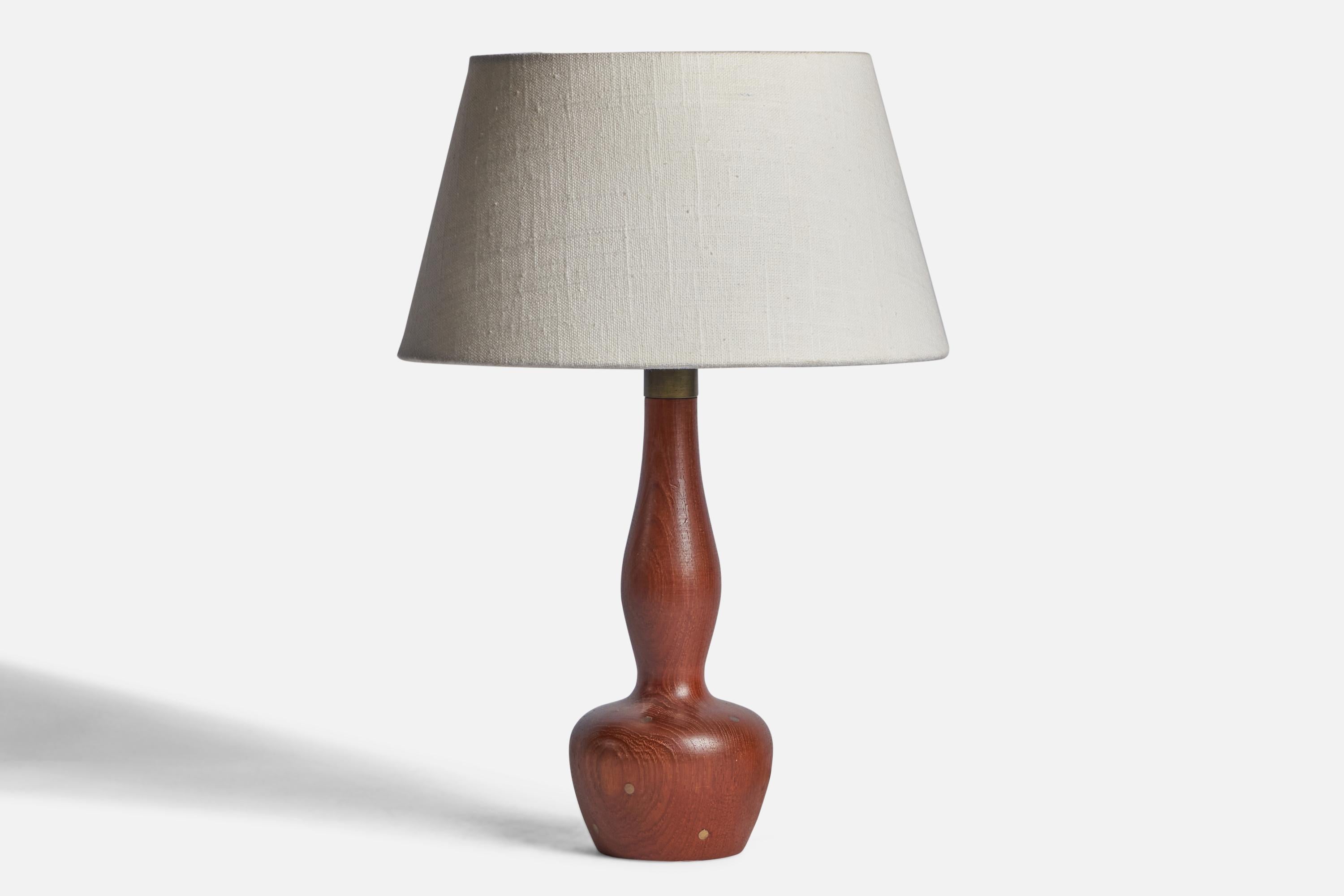 A teak table lamp with brass inlays designed and produced in Denmark, 1950s.

Dimensions of Lamp (inches): 11.55” H x 3.8” Diameter
Dimensions of Shade (inches): 7” Top Diameter x 10” Bottom Diameter x 5.5” H 
Dimensions of Lamp with Shade (inches):