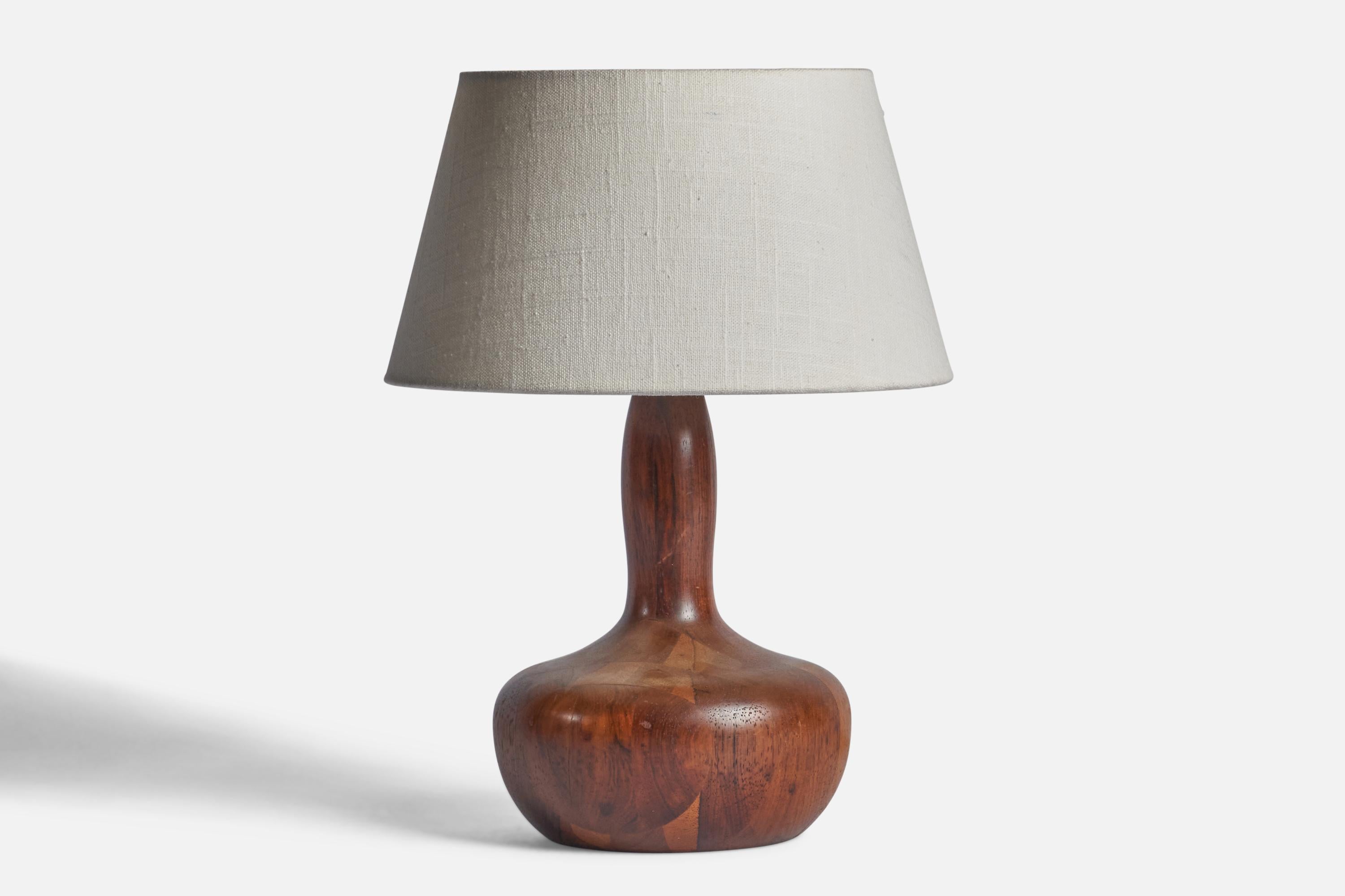 An organic walnut table lamp designed and produced in Denmark, 1950s.

Dimensions of Lamp (inches): 10.75