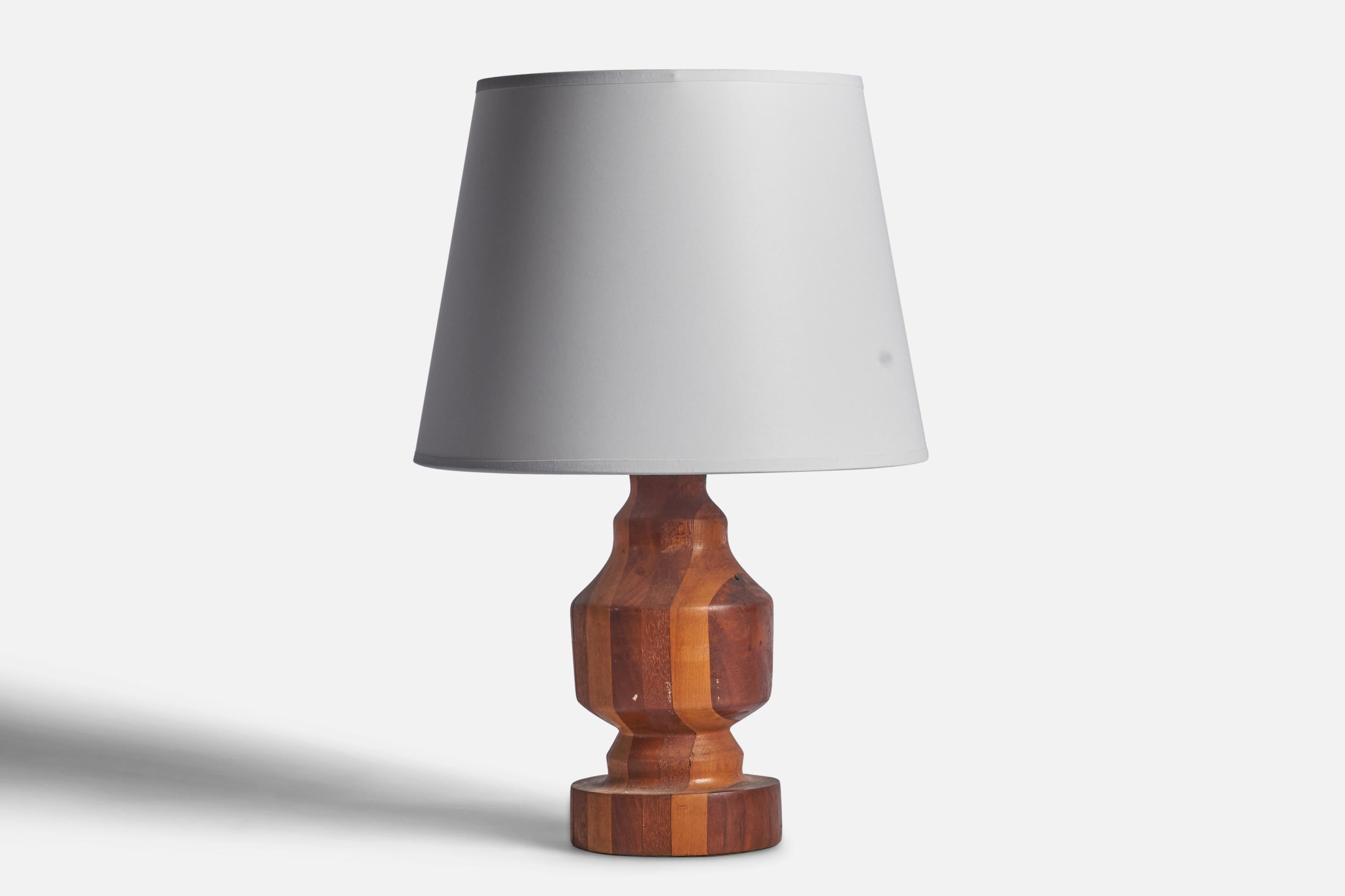 A stack-laminated wood table lamp designed and produced in Denmark, c. 1950s.

Dimensions of Lamp (inches): 12.5” H x 5” Diameter
Dimensions of Shade (inches): 8.75” Top Diameter x 12” Bottom Diameter x 9” H 
Dimensions of Lamp with Shade (inches):