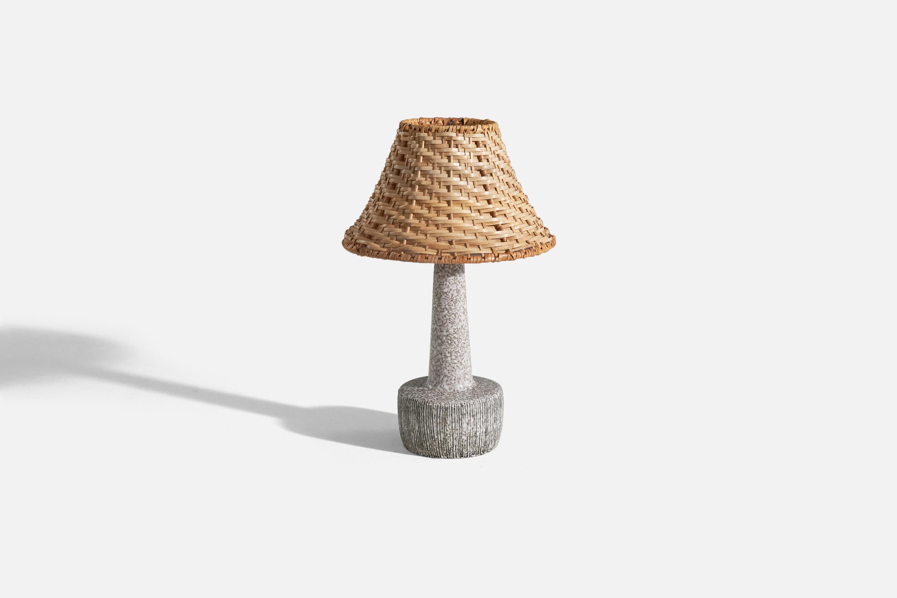 A pair of gray, glazed stoneware table lamp designed and produced by a Danish designer, Denmark, c. 1960s.

Sold with lampshades. 
Dimensions of lamp (inches) : 10.93 x 4.5 x 4.5 (Height x Width x Depth)
Dimensions of shade (inches) : 4 x 8.75 x