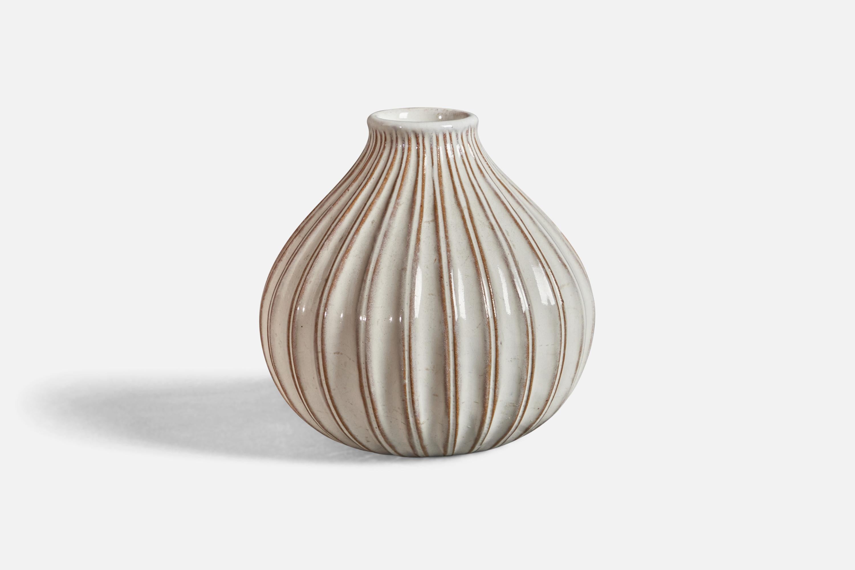 A white-glazed fluted earthenware vase, designed and produced in Denmark, c. 1940s.
