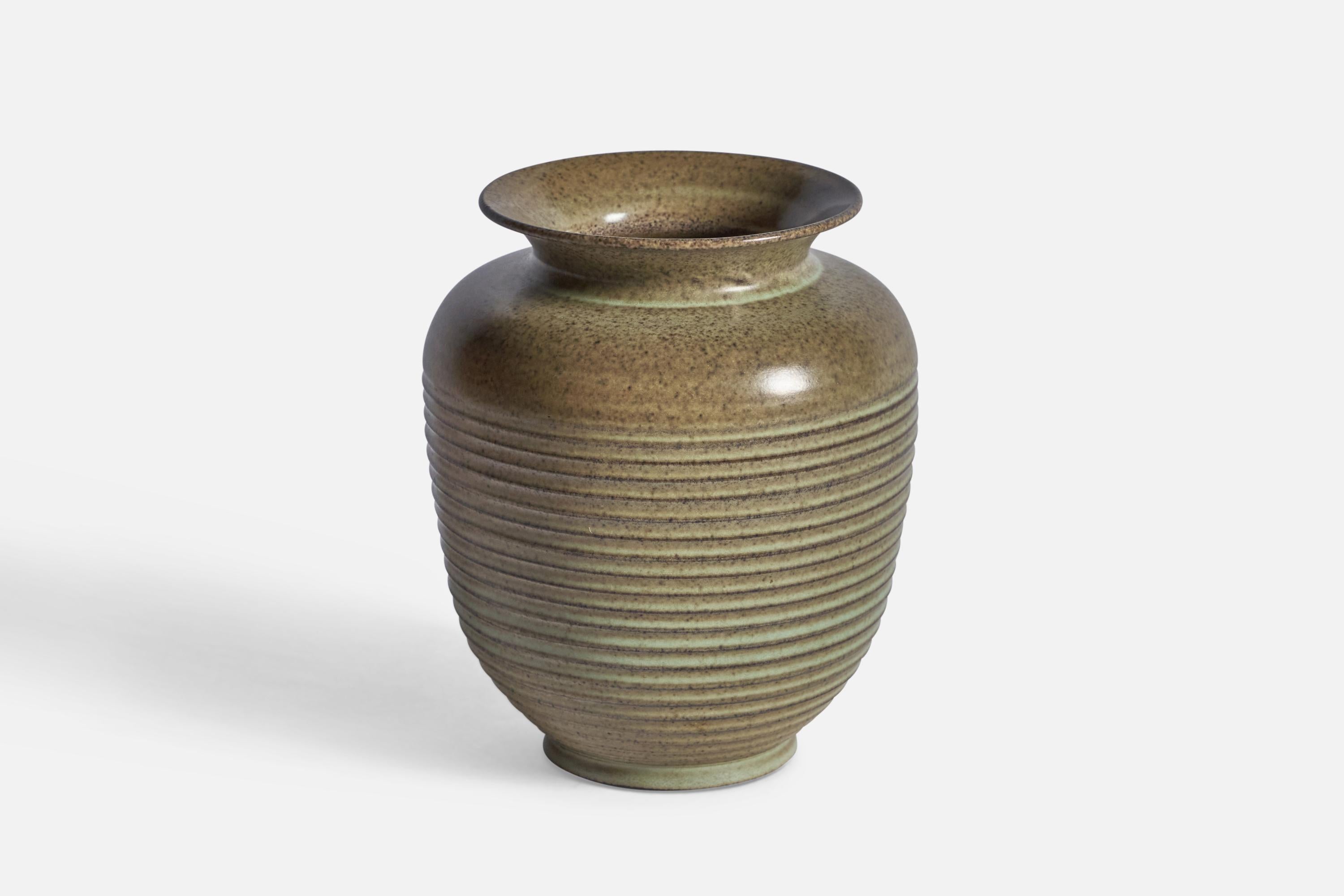 A green and brown-glazed incised stoneware vase, designed and produced in Denmark, c. 1940s.