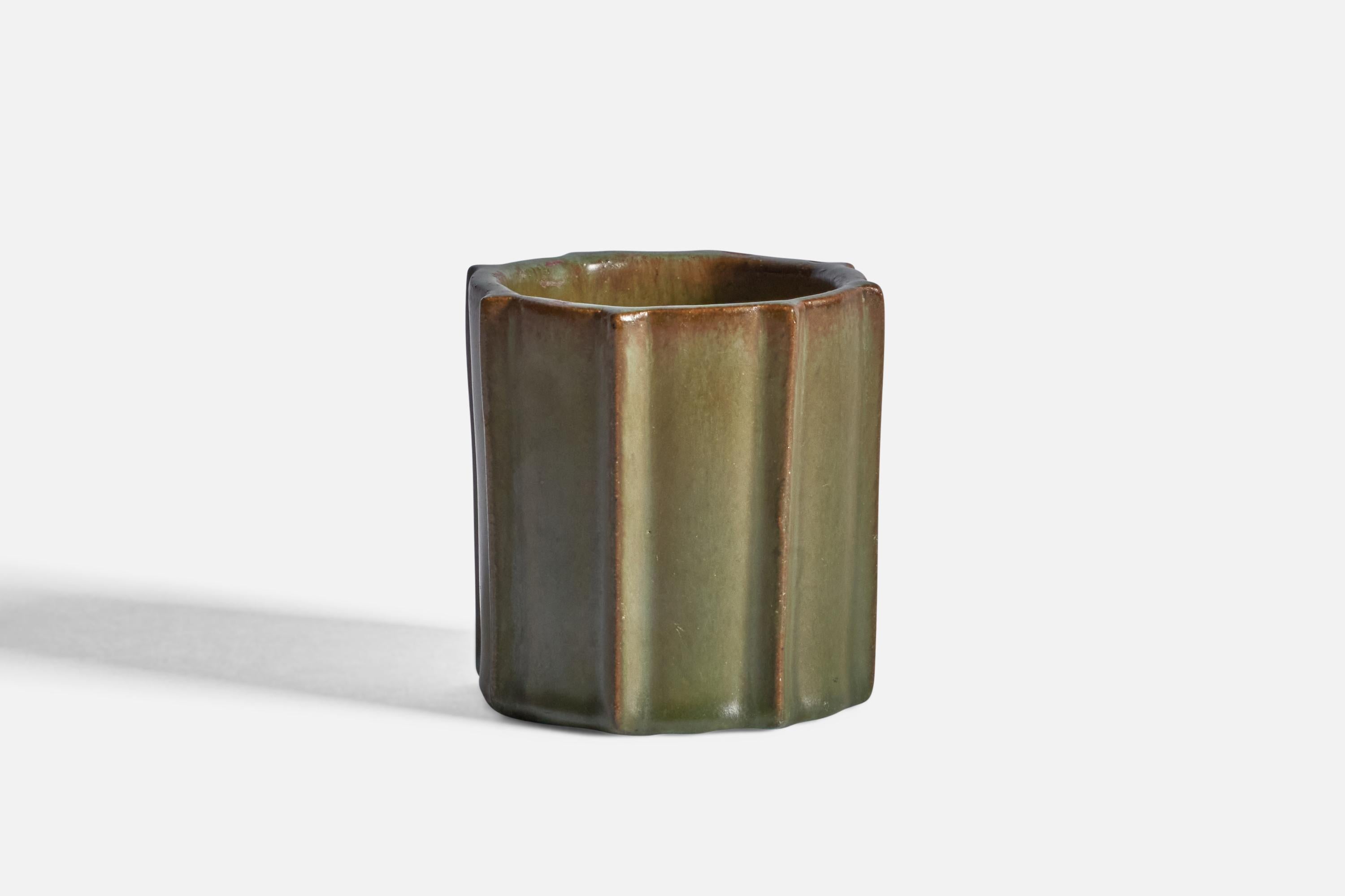 A fluted, green-glazed stoneware vase, designed and produced in Denmark, c. 1940s.