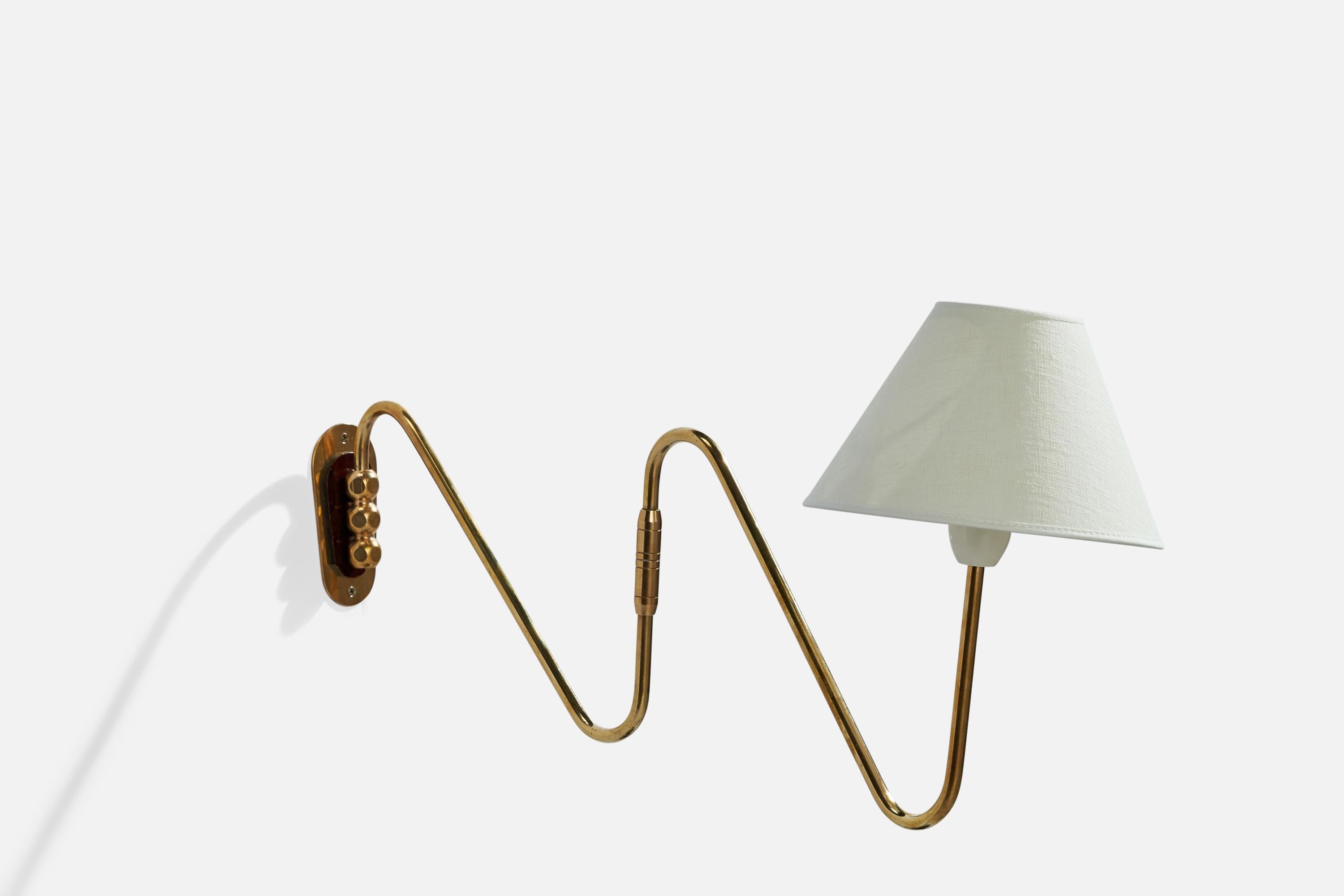 An adjustable brass and white fabric wall light designed and produced in Denmark, 1930s.

Dimensions variable.
Overall Dimensions (inches): 10.5”  H x 11” W x 21.5” D
Back Plate Dimensions (inches): 4.75” H x 2.25” W x .25” D
Bulb Specifications: