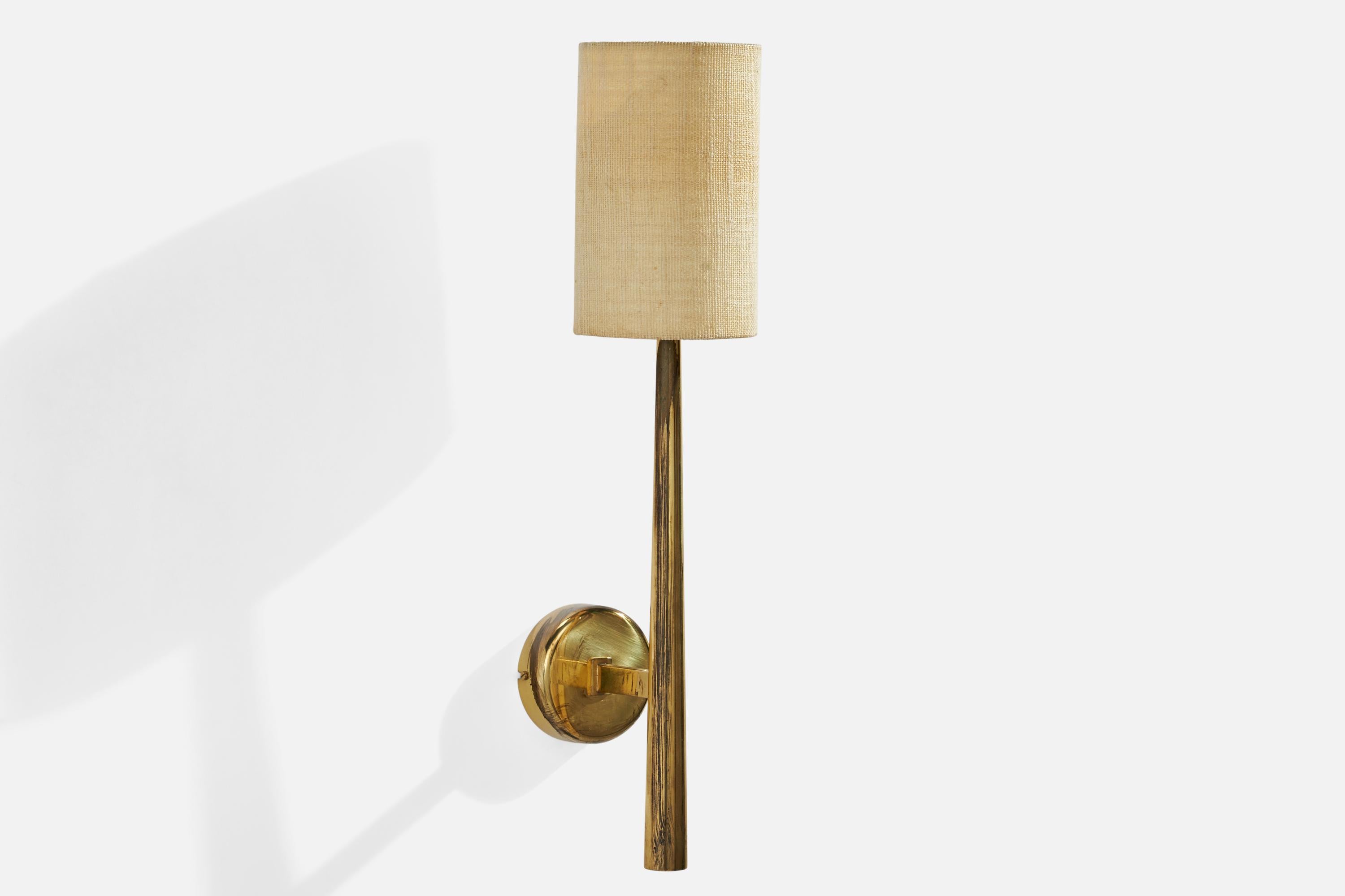 A brass and fabric wall light designed and produced in Denmark, 1950s.

Overall Dimensions (inches): 19”  H x 4.25”  W x 6”  D
Back Plate Dimensions (inches): 3.25”  H x 3.25” W x 1.0” D
Bulb Specifications: E-14 Bulb
Number of Sockets: 1
All