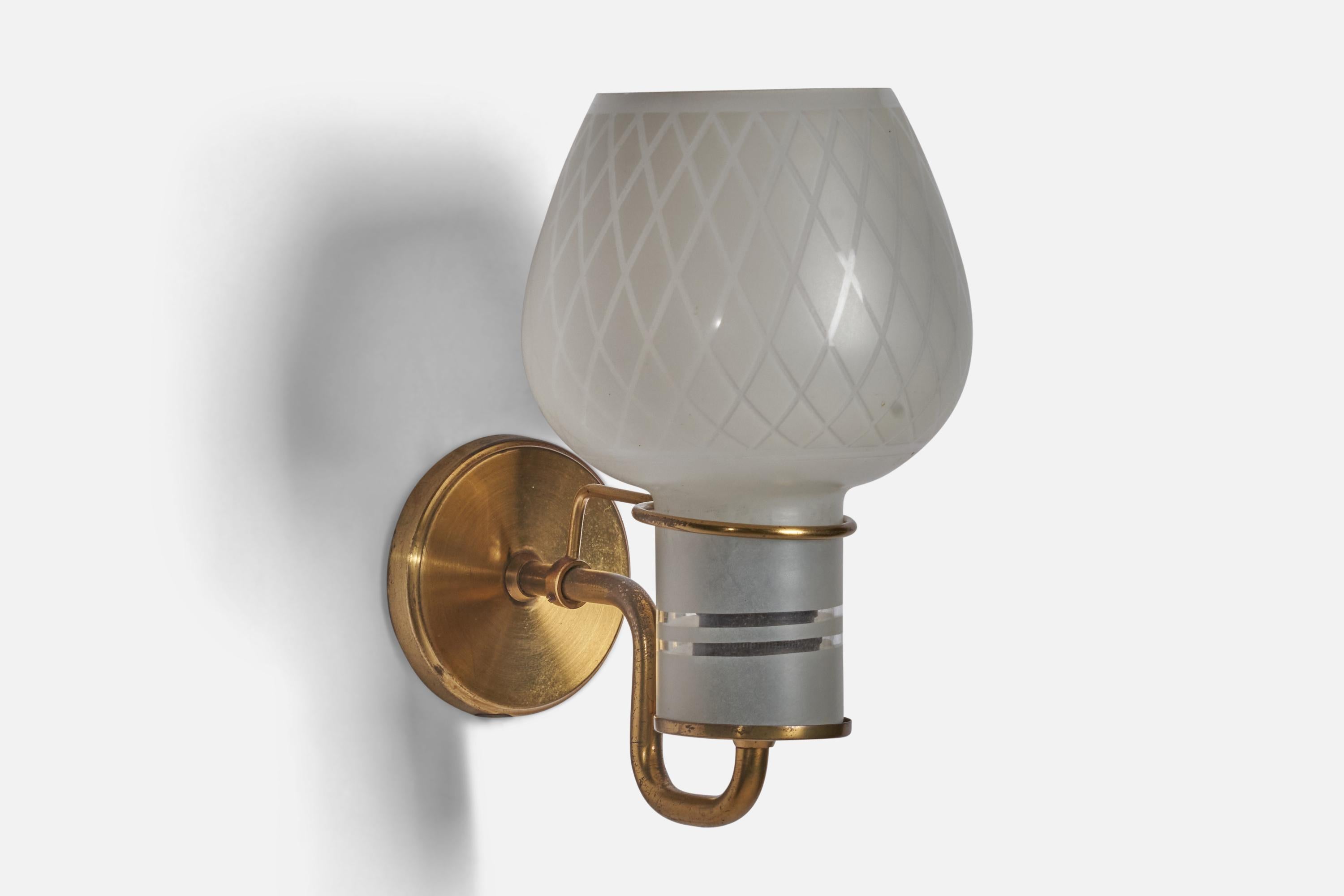 A brass and semi-frosted glass wall light designed and produced in Denmark, 1940s.

Overall Dimensions (inches): 8.5” H x 5” W x 7” D
Back Plate Dimensions (inches): 3.4” Diameter
Bulb Specifications: E-26 Bulb
Number of Sockets: 1
All lighting will