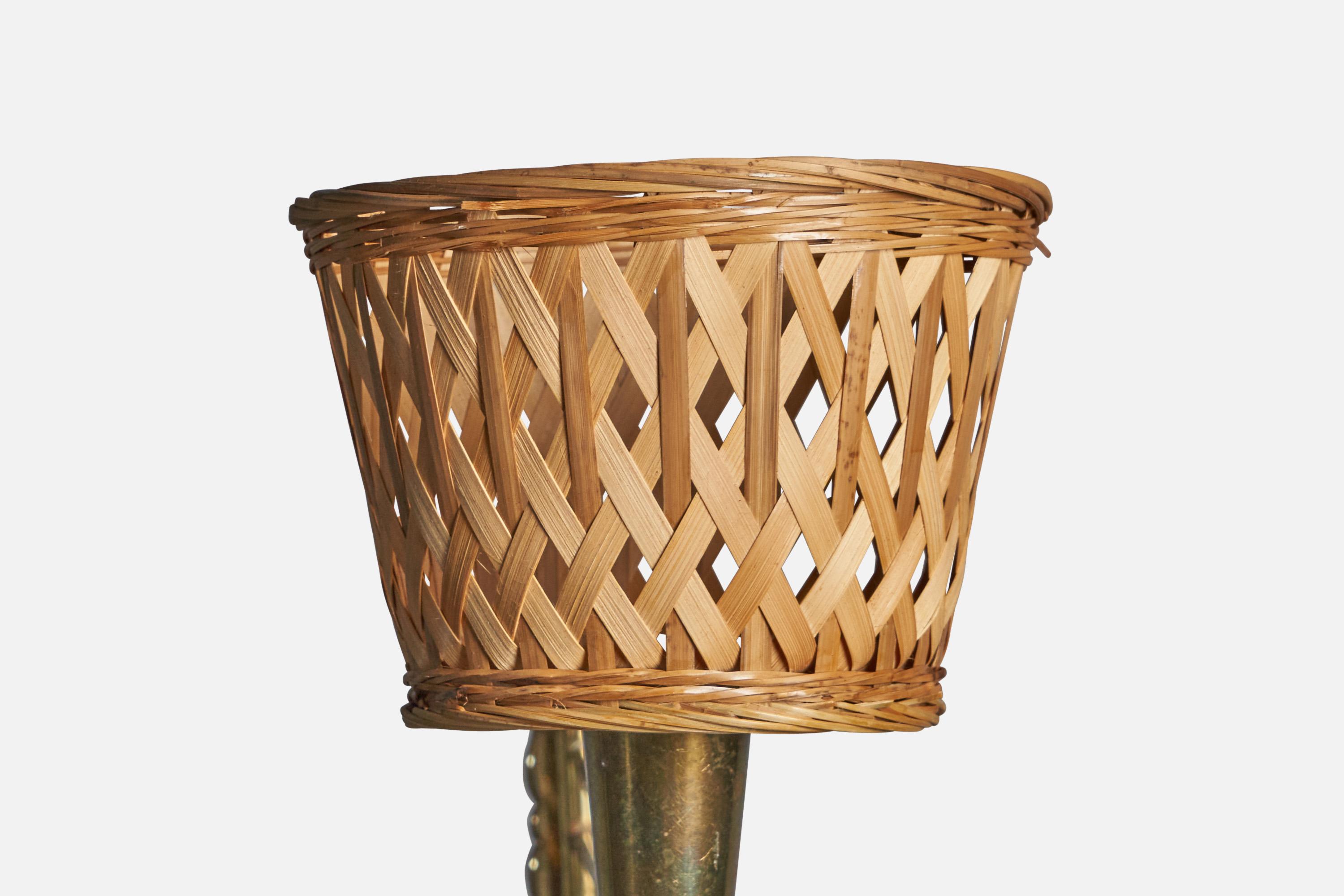 A brass and rattan wall light, designed and produced in Denmark, c. 1940s.

Overall Dimensions (inches): 9.4