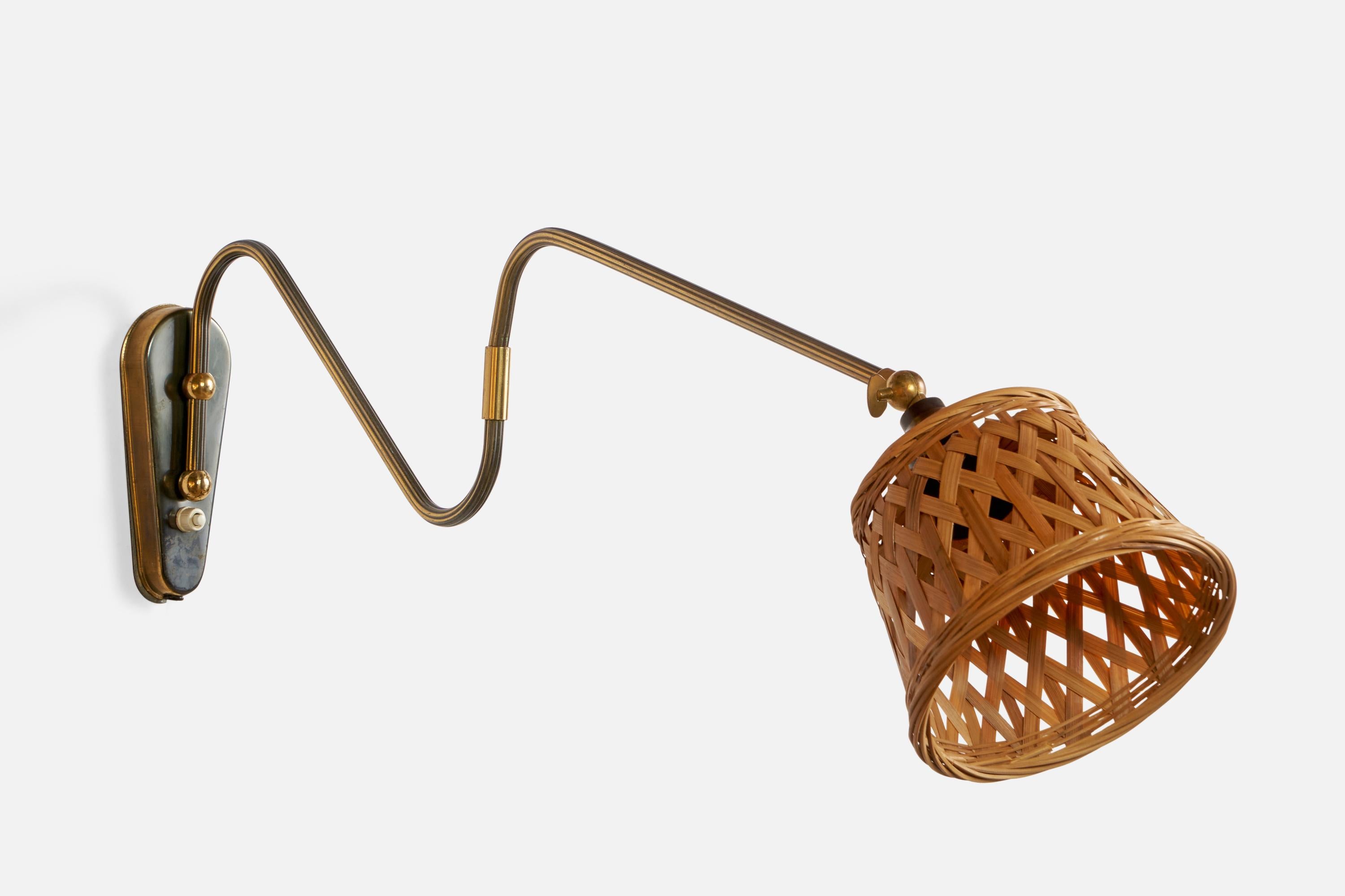 An adjustable brass and rattan wall light designed and produced in Denmark, 1940s.

Overall Dimensions (inches): 9.5” H x 6.5” W x 29” D
Back Plate Dimensions (inches): 6” H x 2.5” W x 0.75” D
Bulb Specifications: E-26 Bulb
Number of Sockets: 1
All