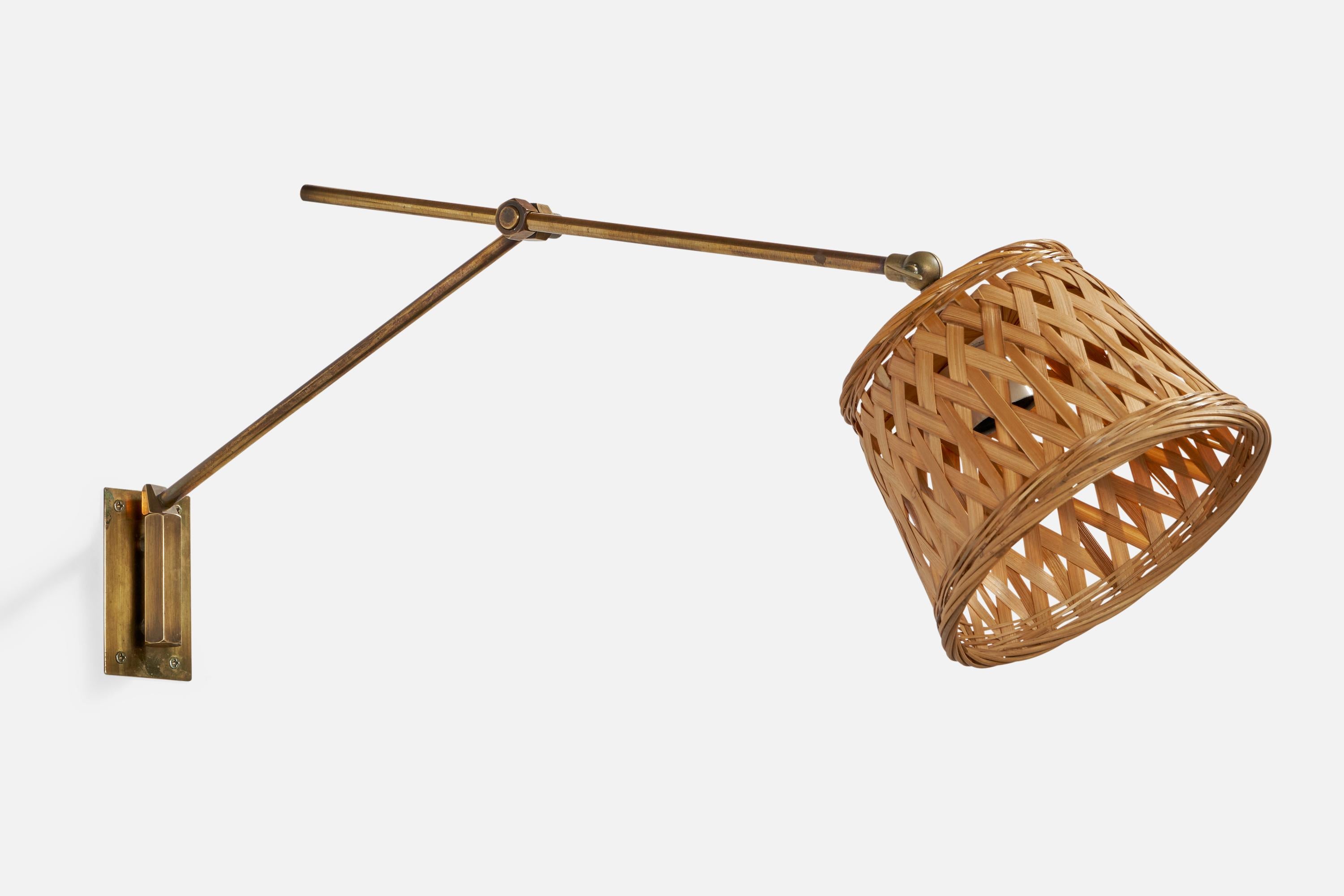 An adjustable brass and rattan wall designed and produced in Denmark, 1940s.

Please note cord feeds from stem connected to socket, configured for plug-in.

Overall Dimensions (inches): 9.15” H x 7.1” W x 25” D
dimensions adjustable based on