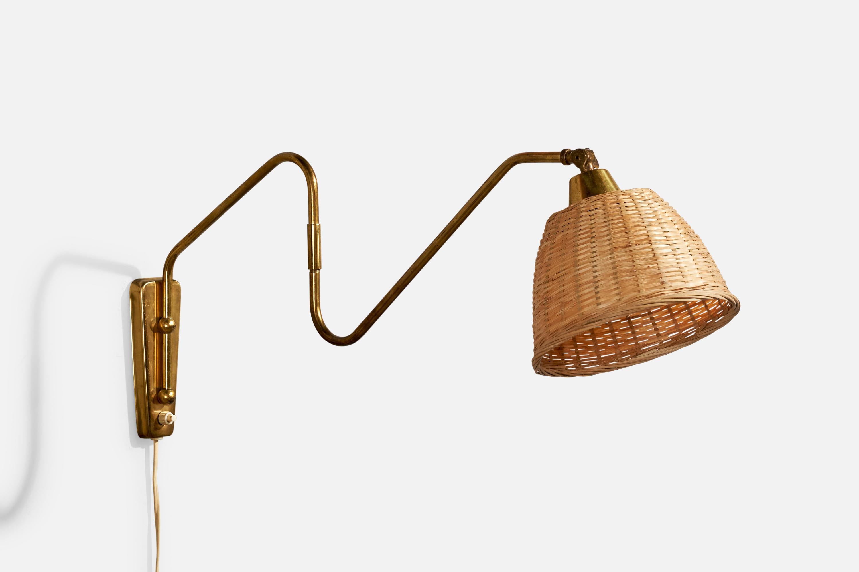Un'applique regolabile in ottone e rattan progettata e prodotta in Danimarca, negli anni '40 circa.

Dimensioni complessive (pollici): 10,5
