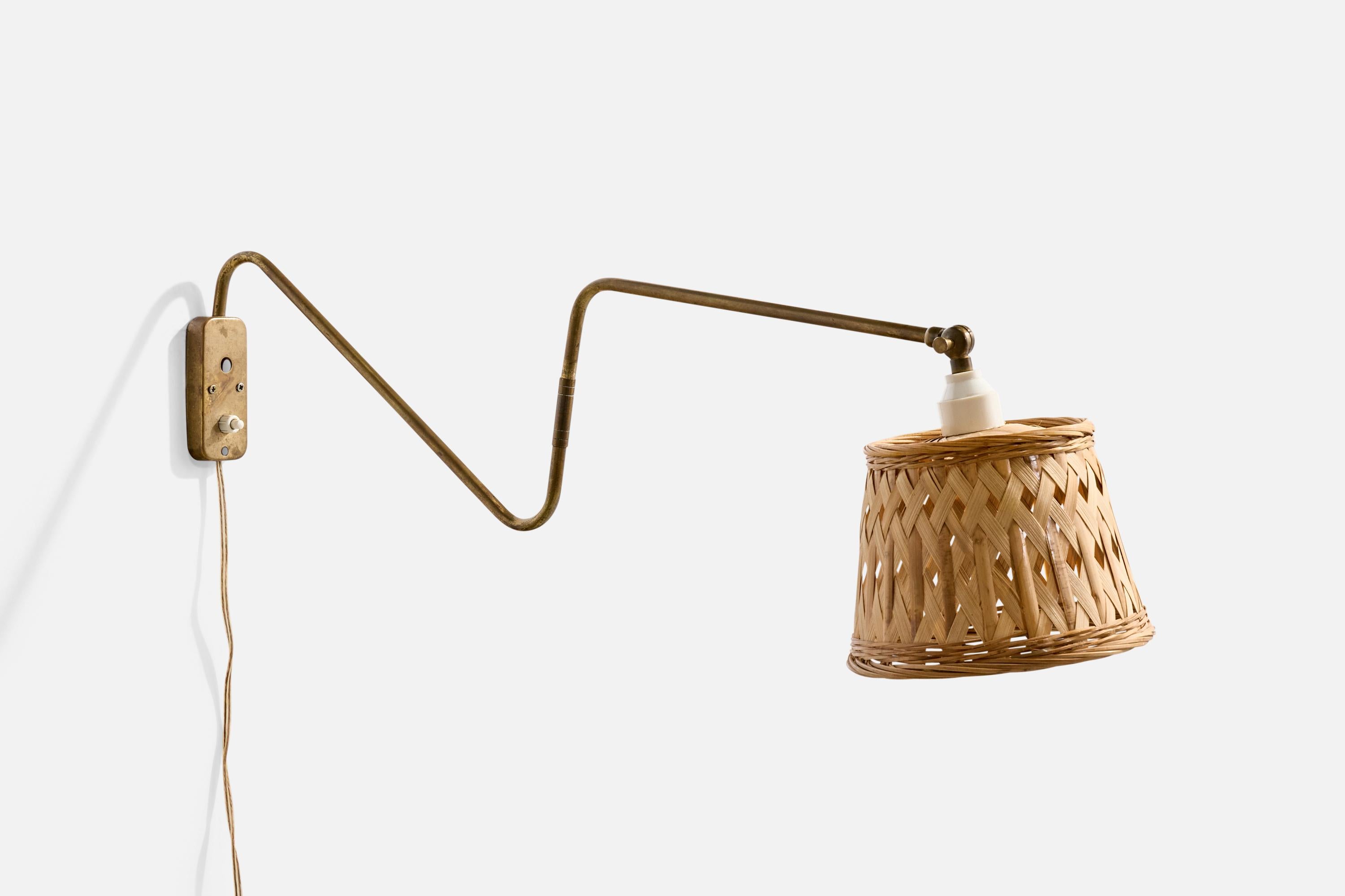 An adjustable brass and rattan wall light designed and produced in Denmark, c. 1940s.

Overall Dimensions (Inches): 7.75” H x 7.15” W x 26.5“ D

Back Plate Dimensions (Inches): 4” H x 1.8” W x .55” D

Bulb Specifications: E-26

Number of Sockets