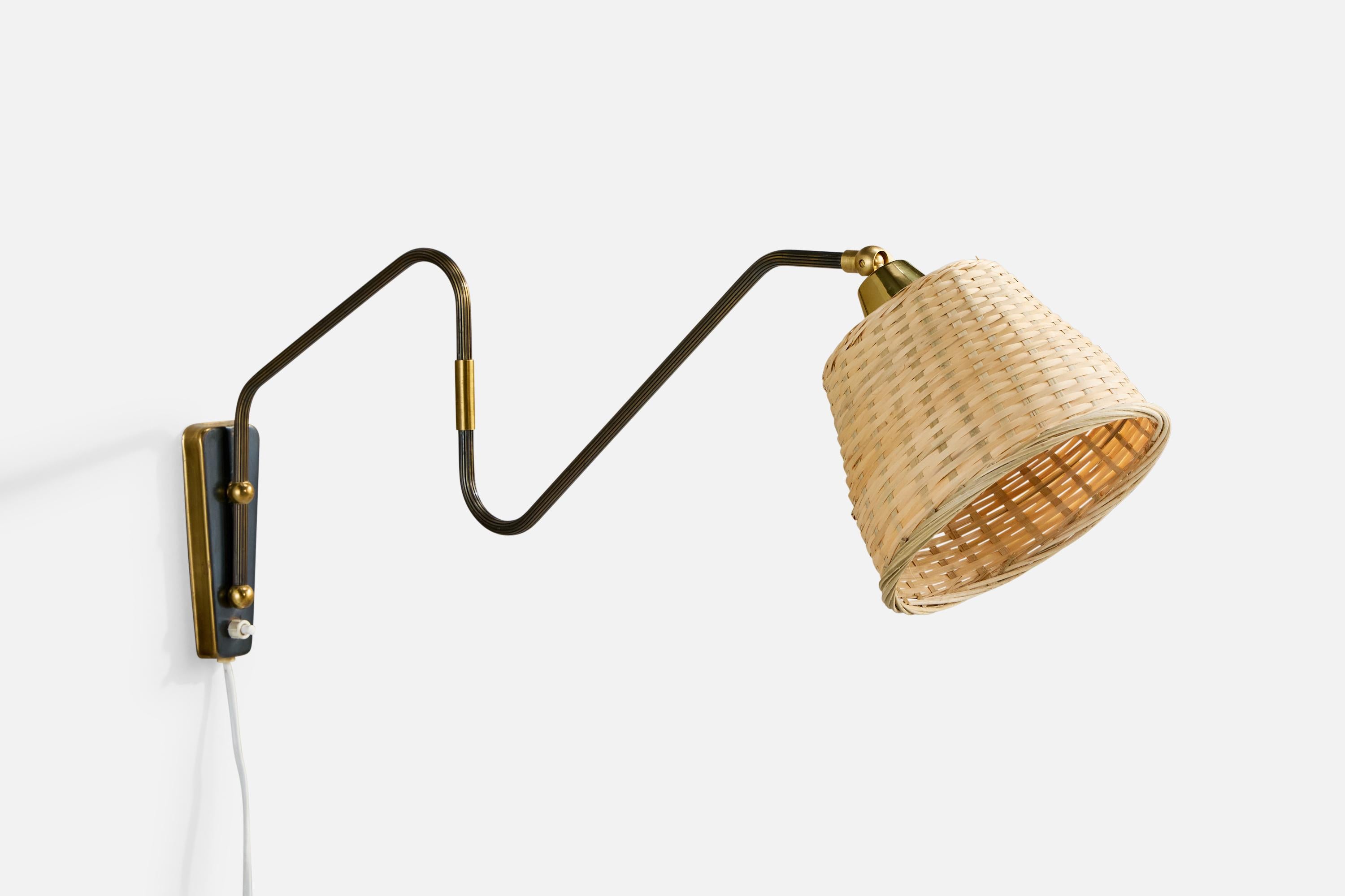 An adjustable brass and rattan wall light designed and produced in Denmark, c. 1950s.

Overall Dimensions (inches): 11.5
