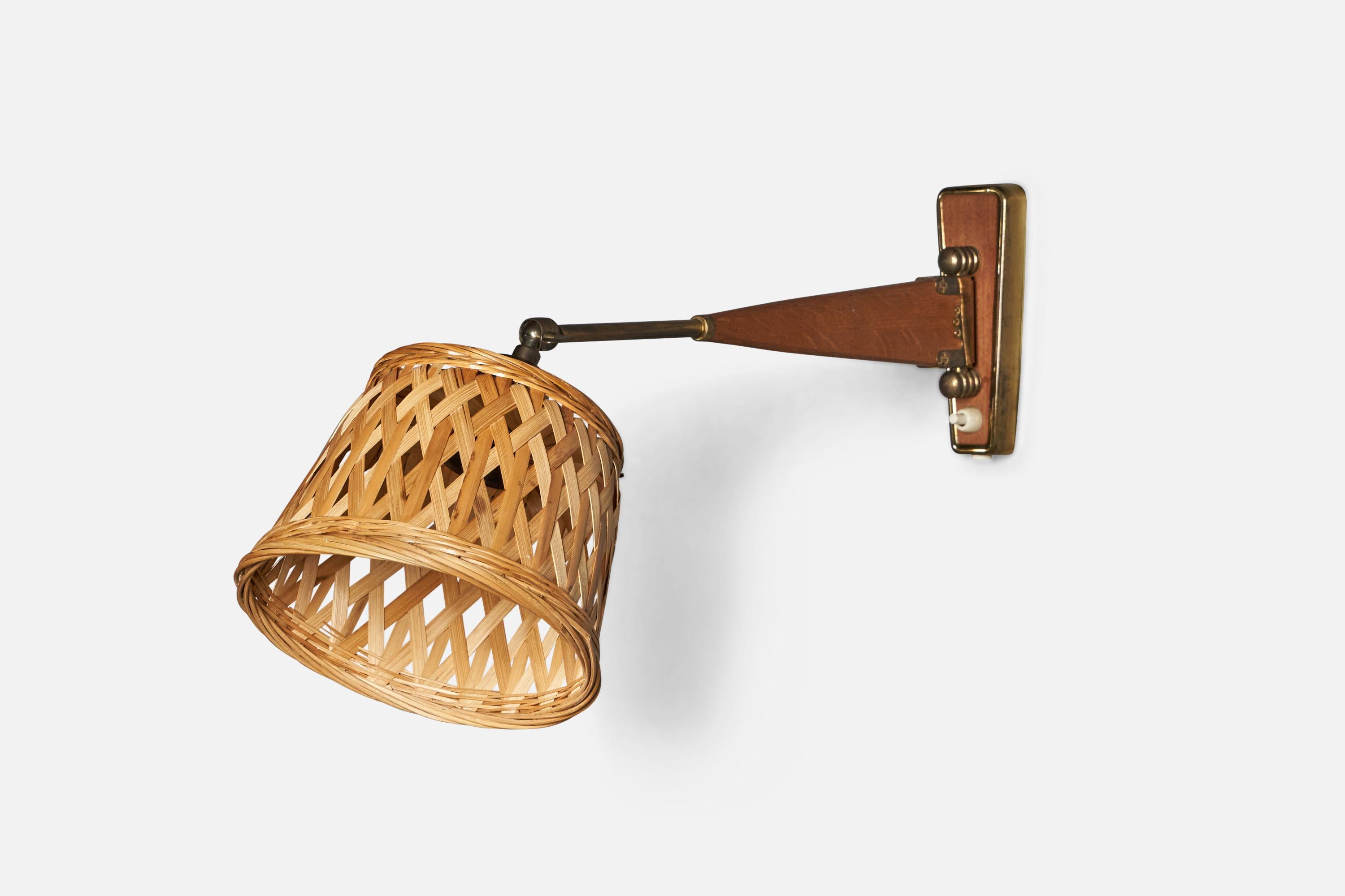 An adjustable brass, teak and rattan wall light designed and produced in Denmark, c. 1950s.

Overall Dimensions (inches): 10” H x 7.5” W x 20” D
Back Plate Dimensions (inches): 6” H x 2.25” W x 0.6” D
Bulb Specifications: E-26 Bulb
Number of